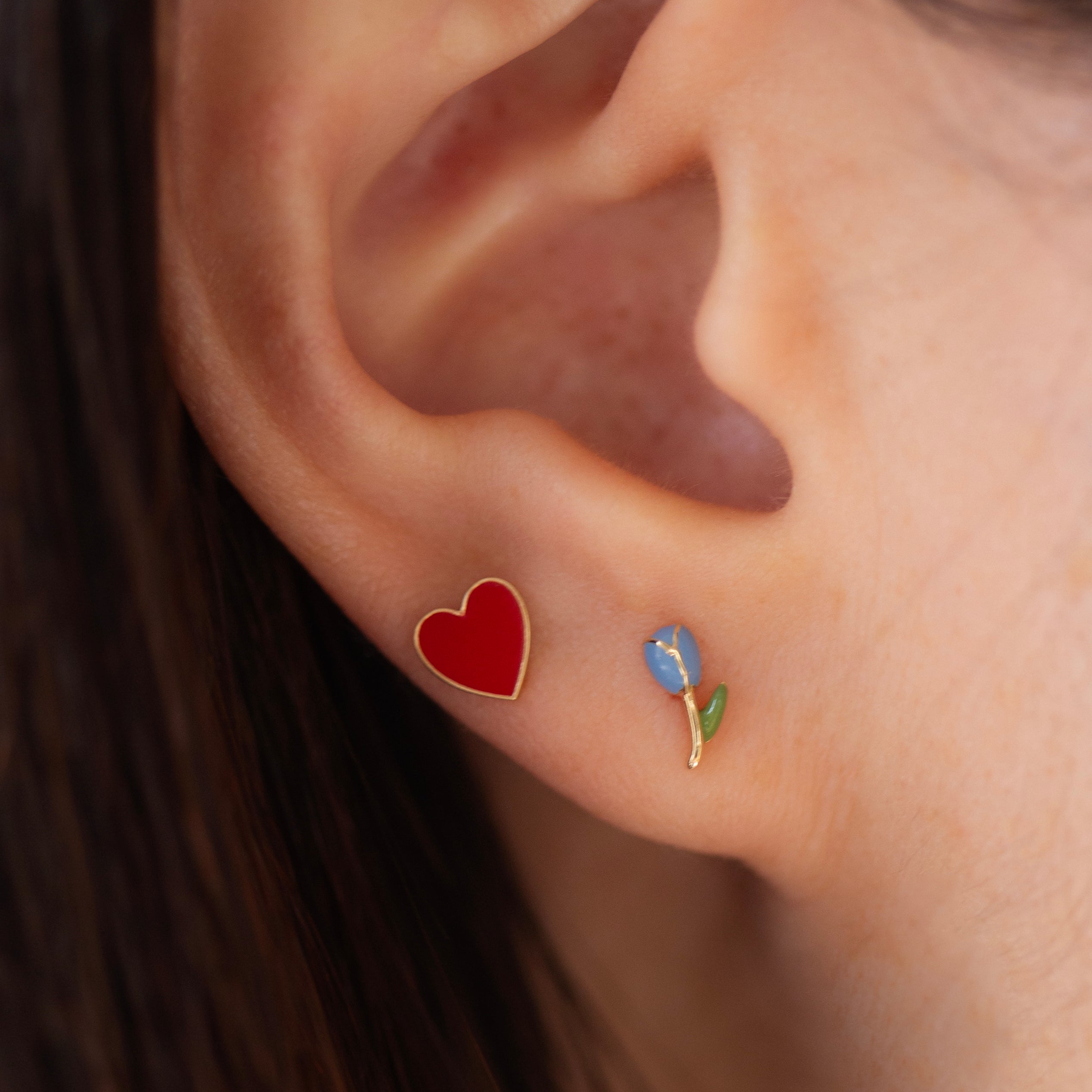 Celebrate love with these red enamel heart stud earrings! The perfect gift for your Valentine or yourself! These red enamel heart stud earrings are the perfect accessory to celebrate love. With their vibrant color and delicate design, they make a thoughtful gift for your Valentine or a special treat for yourself. Add a touch of love to any outfit with these beautiful earrings.