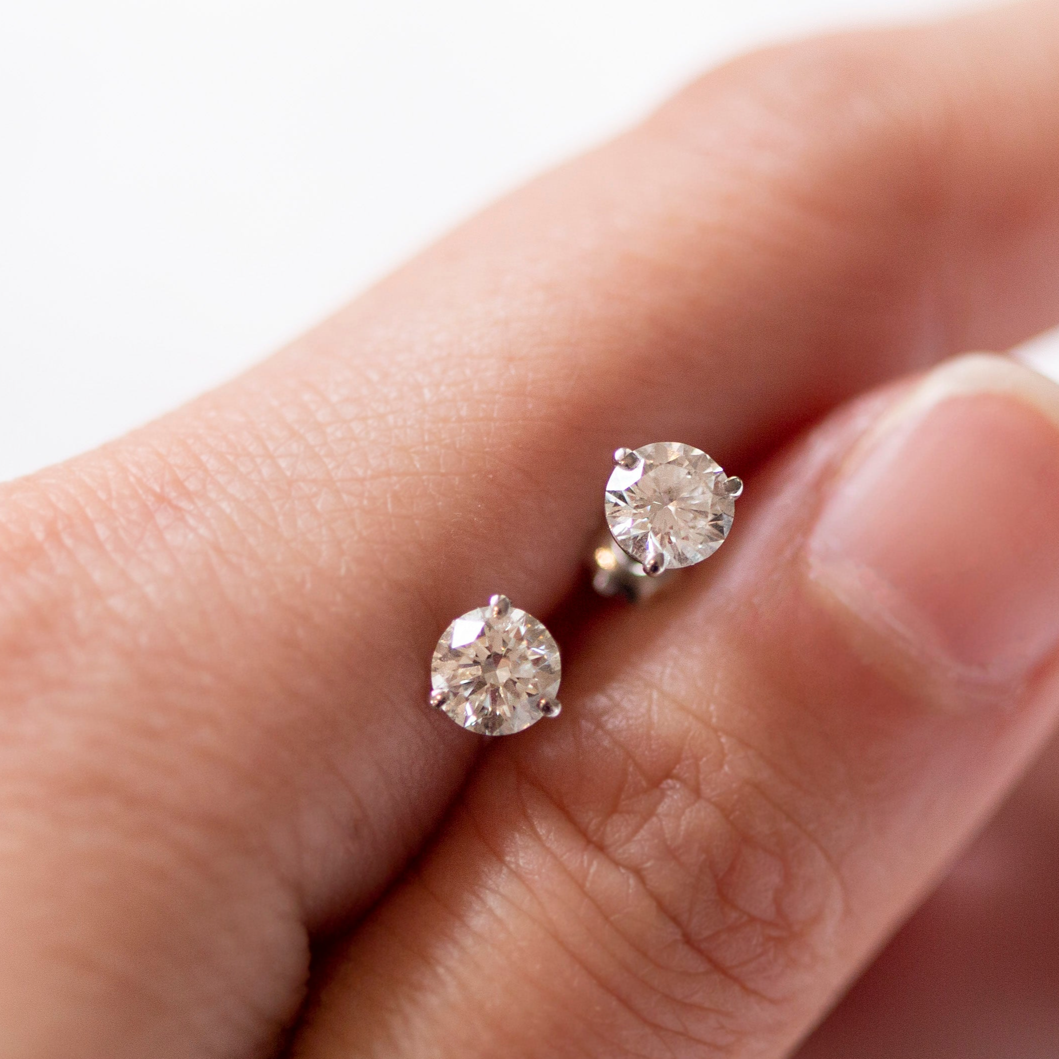 Enhance your elegance with these exquisite 14Kt gold lab diamond earrings, featuring a mesmerizing 1 Ct. TW. Martini set for a touch of sophistication. A must-have staple for every occasion.