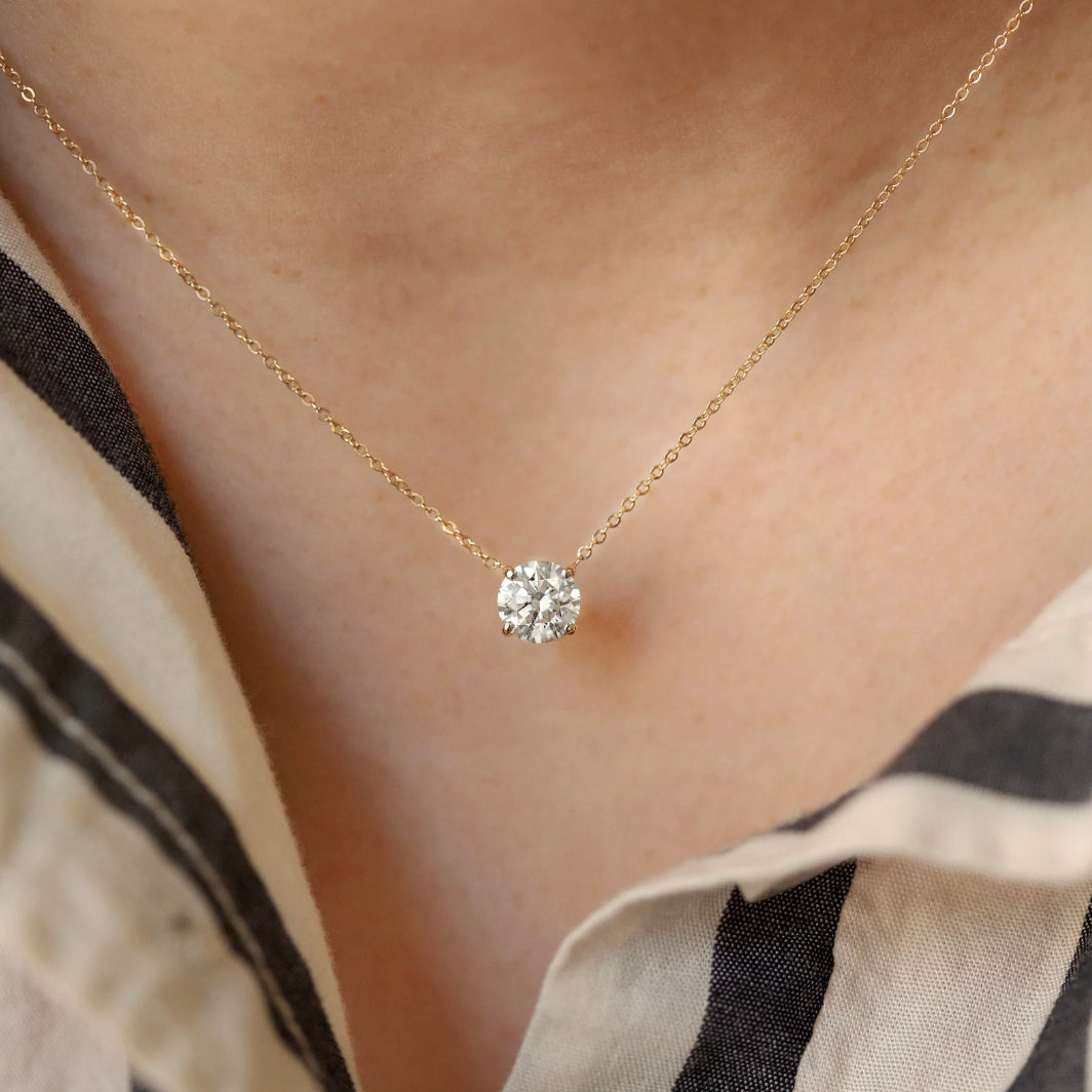 Elevate your look with the classic Diamond Necklace. Featuring a graceful floating lab-grown diamond set in a 4-prong setting for maximum sparkle and brilliance, this exquisite 14k white gold pendant is a classic piece that will bring allure to any ensemble.
