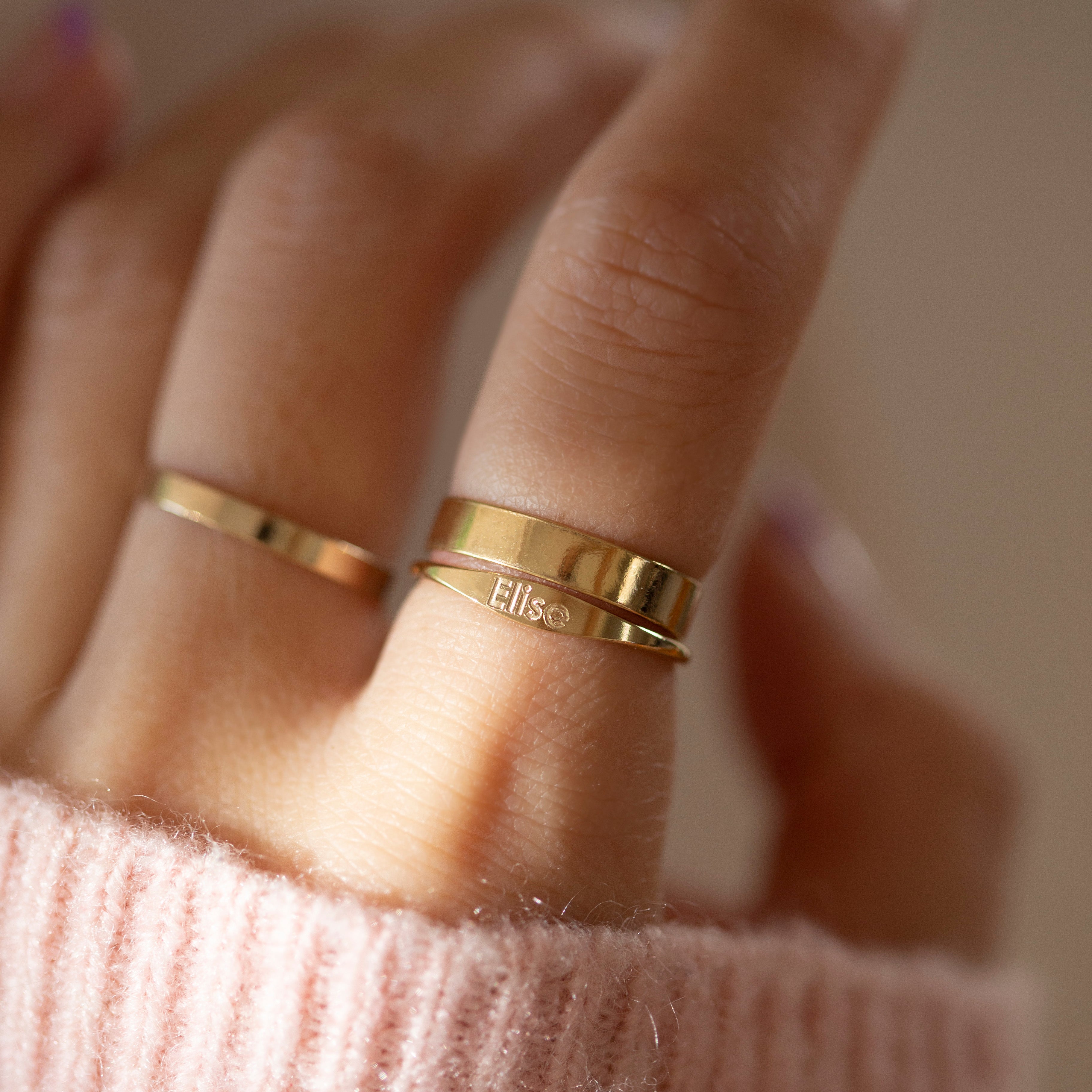 Custom engraved name ring in 14k gold filled will become a cherished keepsake.
Smooth gold accents and delicate engraving offers timeless elegance to any ensemble.
Personalize it with your own name or a special someone's to celebrate an unforgettable moment.
Will last longer than gold plated, silver plated it is made of gold filled.
Perfect special meaningful gift for that special someone.