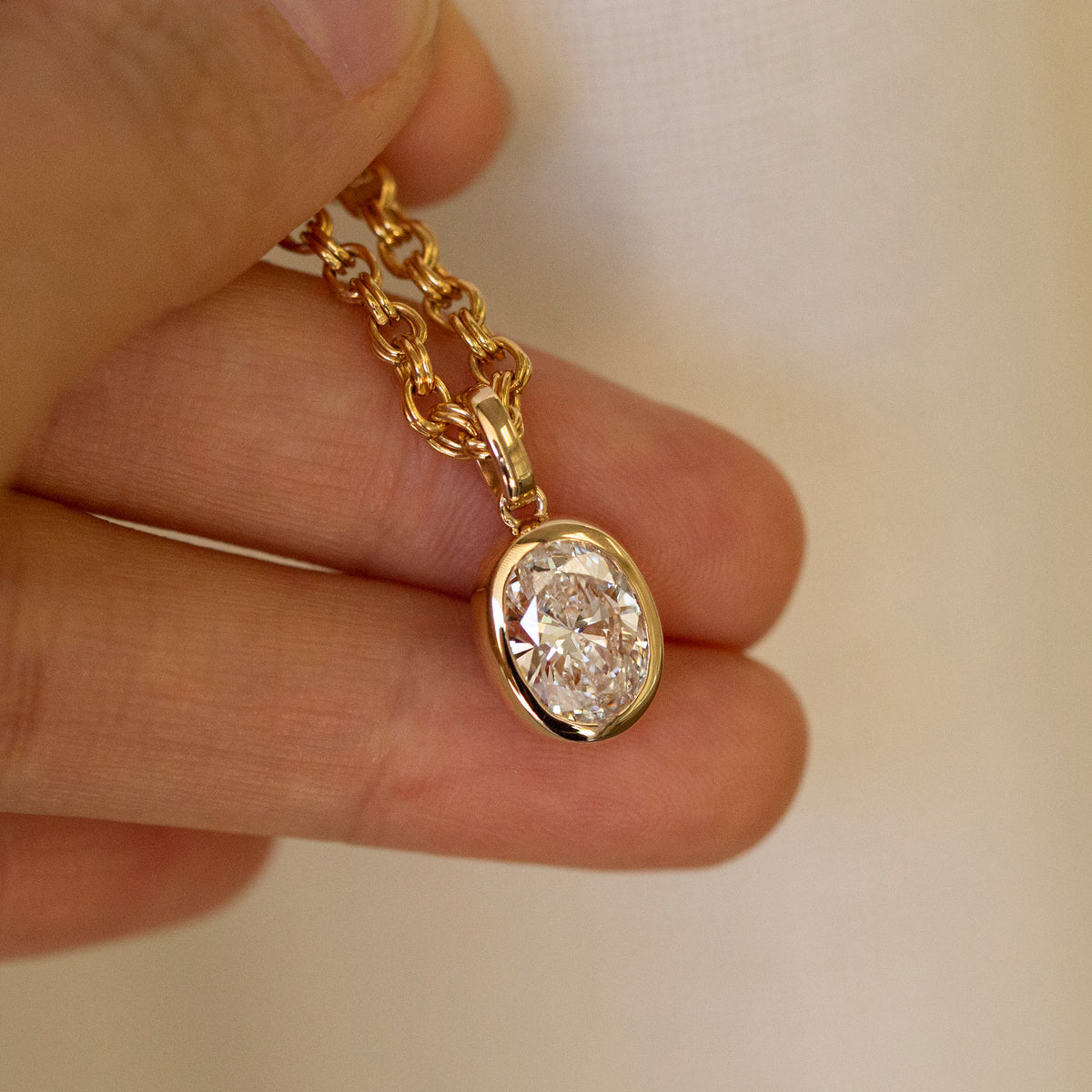 2 carat oval lab diamond bezel pendant in 14k gold