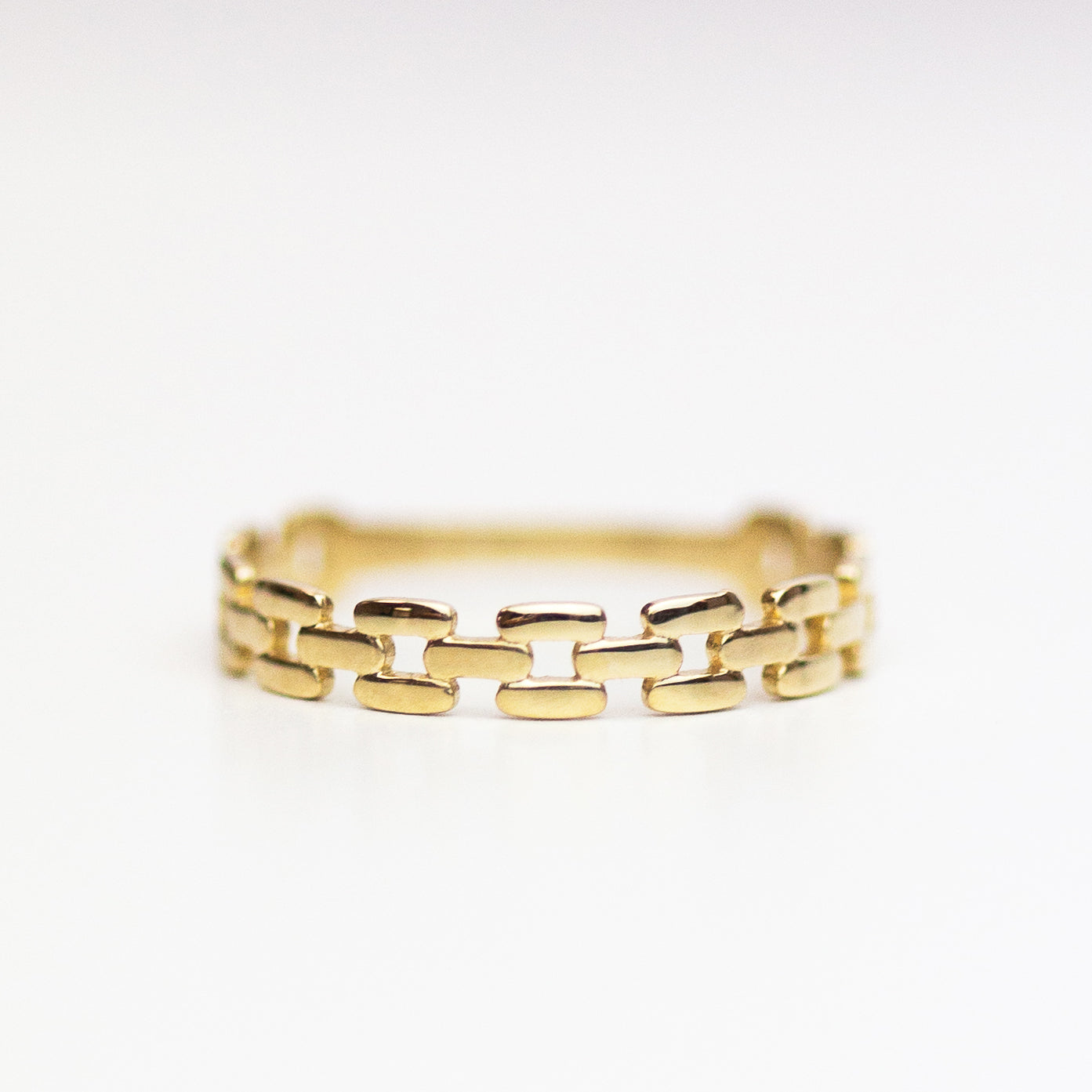 This lustrous 14-karat yellow gold ring is adorned with an open square link design, polished to a brilliant finish. Worn alone, it is a statement of style. When paired with other pieces, it adds a touch of drama to any look.