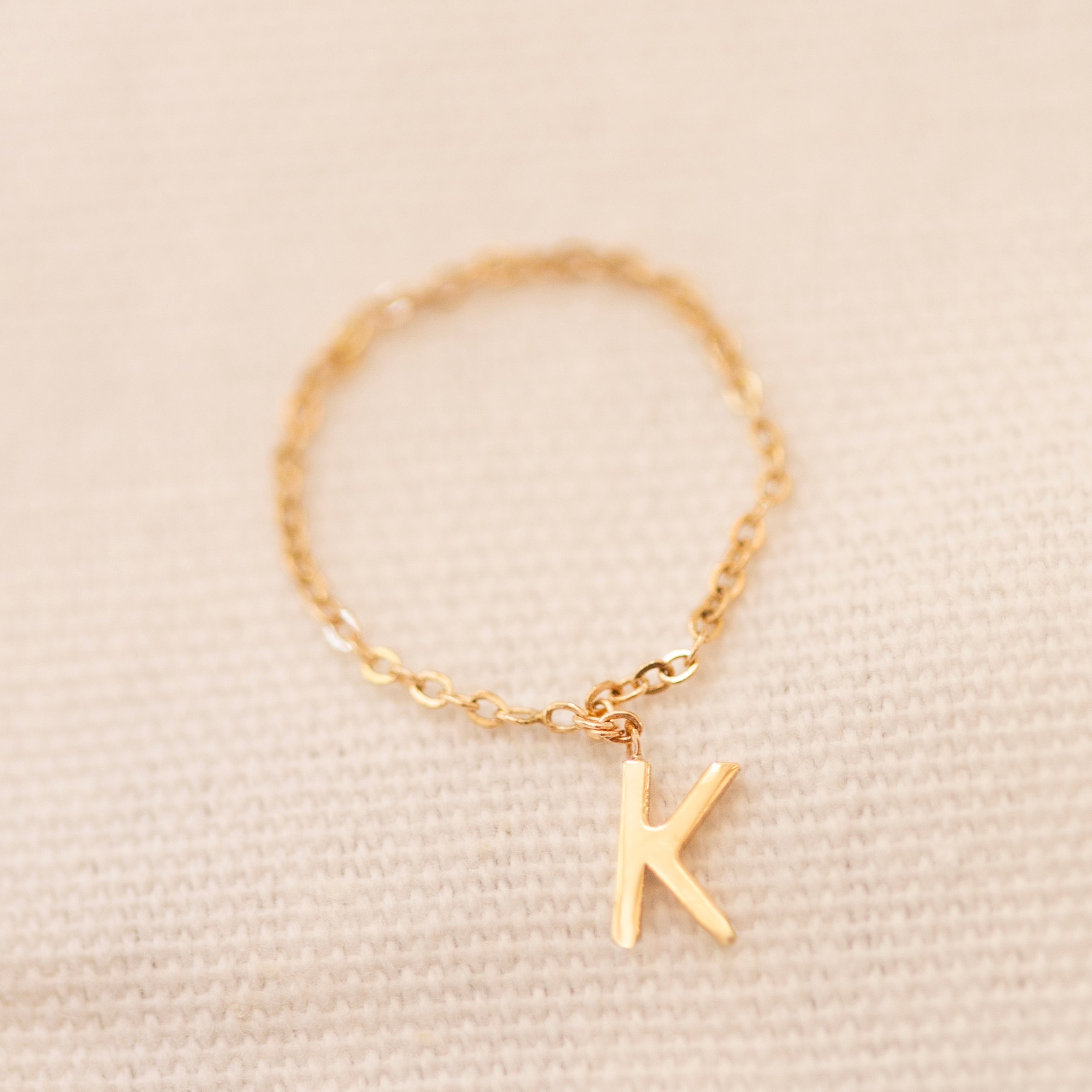 Barely there ring in 14k gold with small initial letter