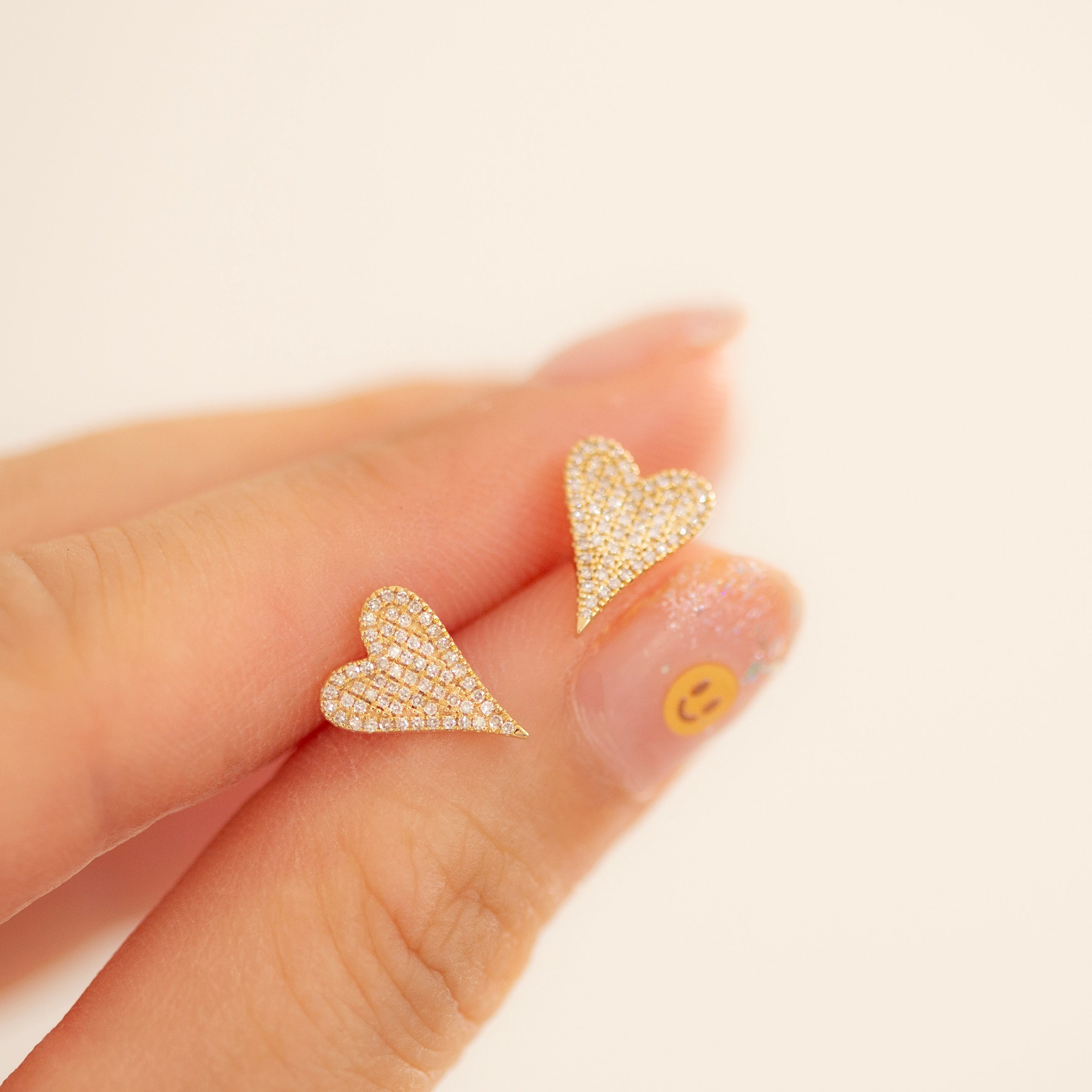 Small Pave Diamond Heart Earrings
Elevate your style with these elegant 14K Small Pave Diamond Heart Earrings. Exquisitely crafted with small pave diamonds for a subtle yet, luxurious look. These earrings make a perfect gift or an exquisite addition to your own collection. Be sure to sparkle and shine with these exquisite heart-shaped delights.