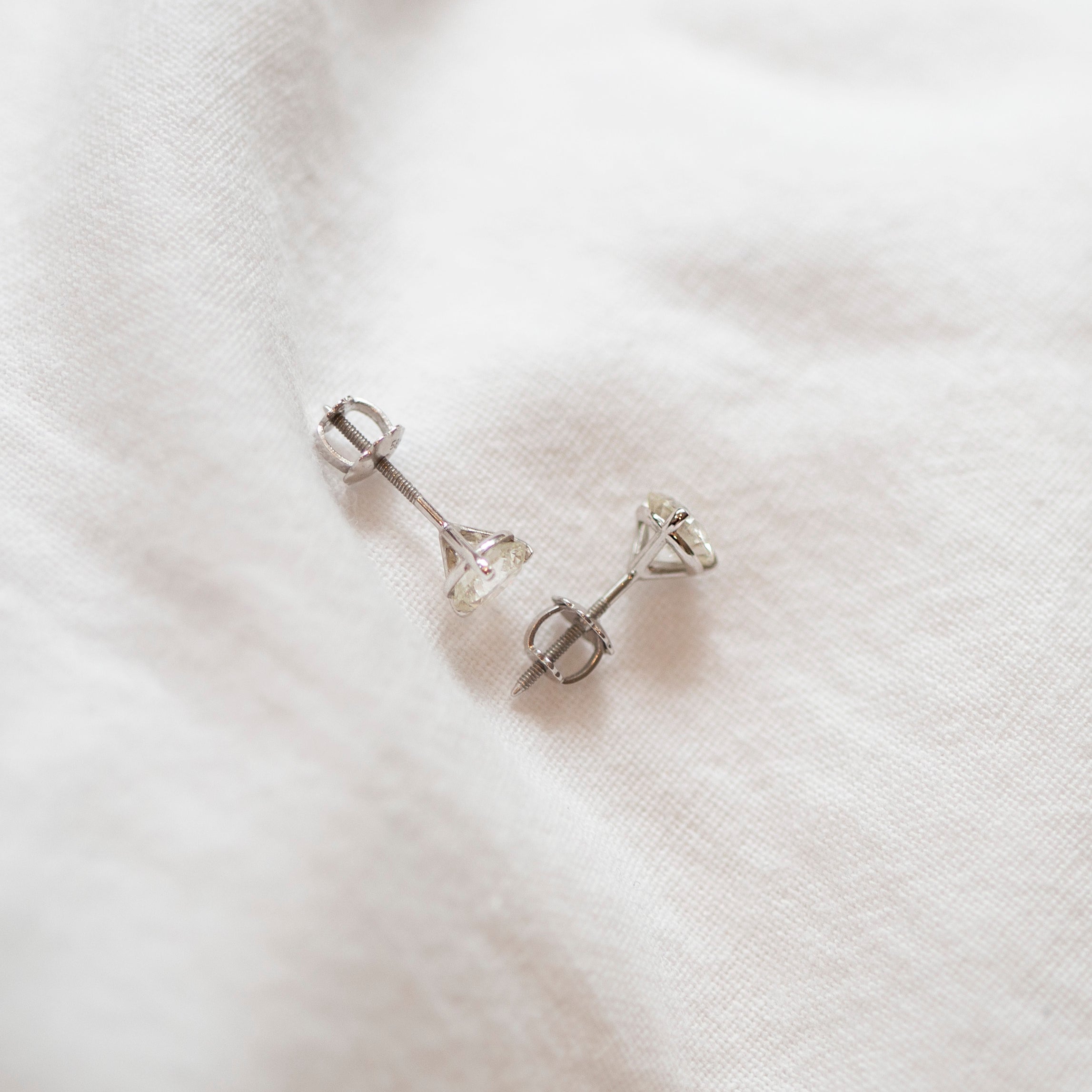 Enhance your elegance with these exquisite 14Kt gold lab diamond earrings, featuring a mesmerizing 1 Ct. TW. Martini set for a touch of sophistication. A must-have staple for every occasion.