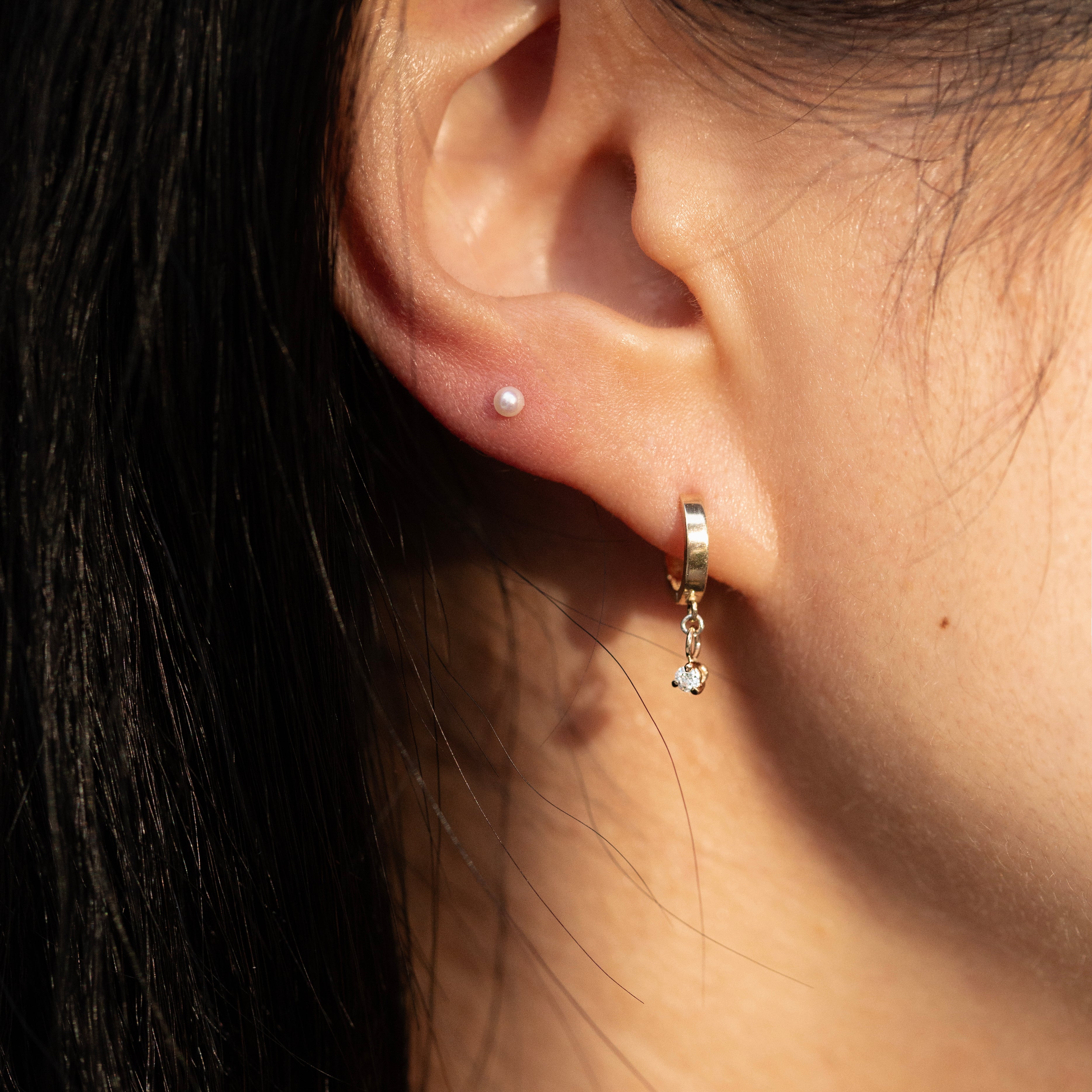 Diamond huggie earrings in yellow gold