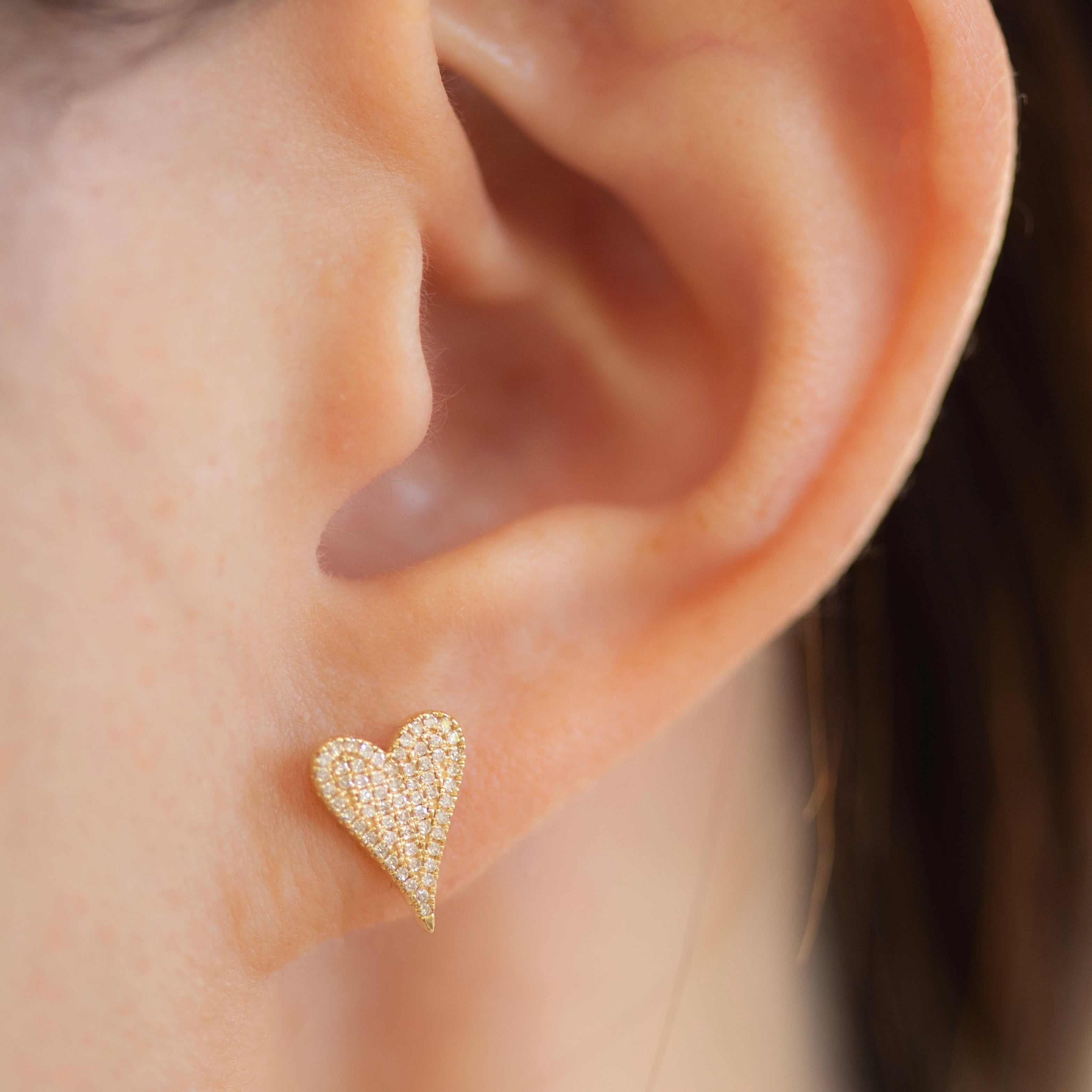 Small Pave Diamond Heart Earrings
Elevate your style with these elegant 14K Small Pave Diamond Heart Earrings. Exquisitely crafted with small pave diamonds for a subtle yet, luxurious look. These earrings make a perfect gift or an exquisite addition to your own collection. Be sure to sparkle and shine with these exquisite heart-shaped delights.