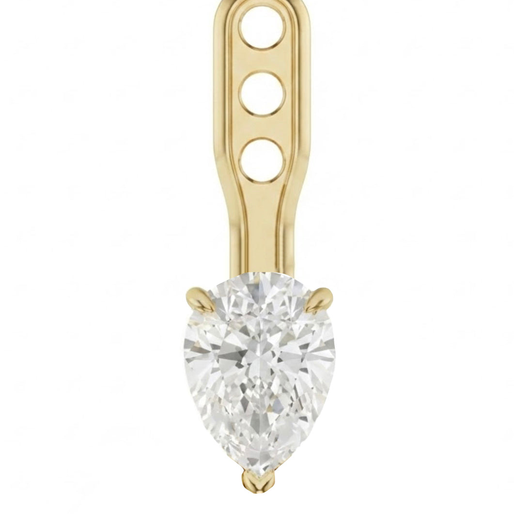 A gold nose stud earring featuring a large pear-cut clear gemstone in a prong setting, with a decorative gold post containing three circular cutouts, shown on a plain white background.