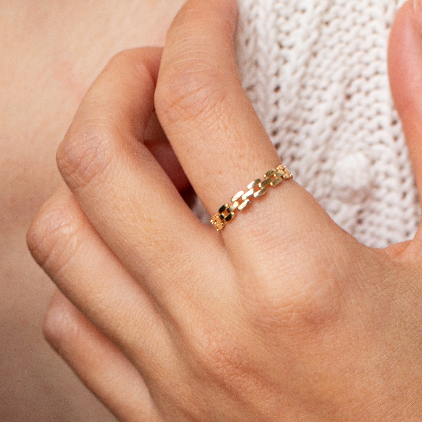 This lustrous 14-karat yellow gold ring is adorned with an open square link design, polished to a brilliant finish. Worn alone, it is a statement of style. When paired with other pieces, it adds a touch of drama to any look.