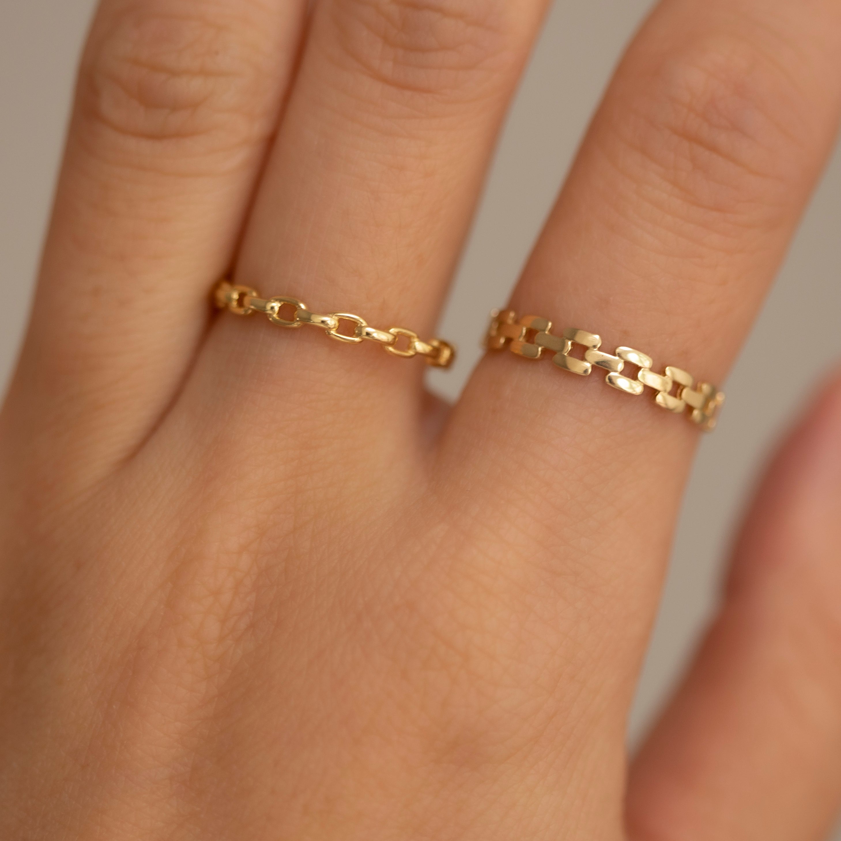 This lustrous 14-karat yellow gold ring is adorned with an open square link design, polished to a brilliant finish. Worn alone, it is a statement of style. When paired with other pieces, it adds a touch of drama to any look.