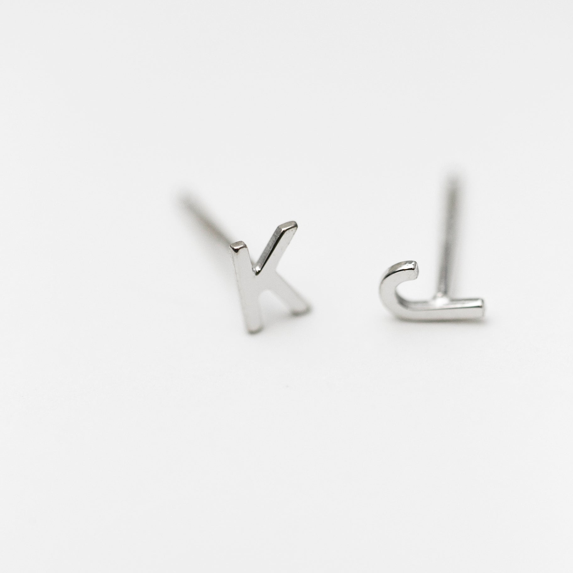 14K Initial stud Earrings - Enhance your style with a touch of sophistication and elegance using our 14K Solid Gold Initial Stud Earrings. Show off your initial and elevate your look with this exquisite accessory. Can be worn alone or paired with other earrings to create a stylish ear stack.
