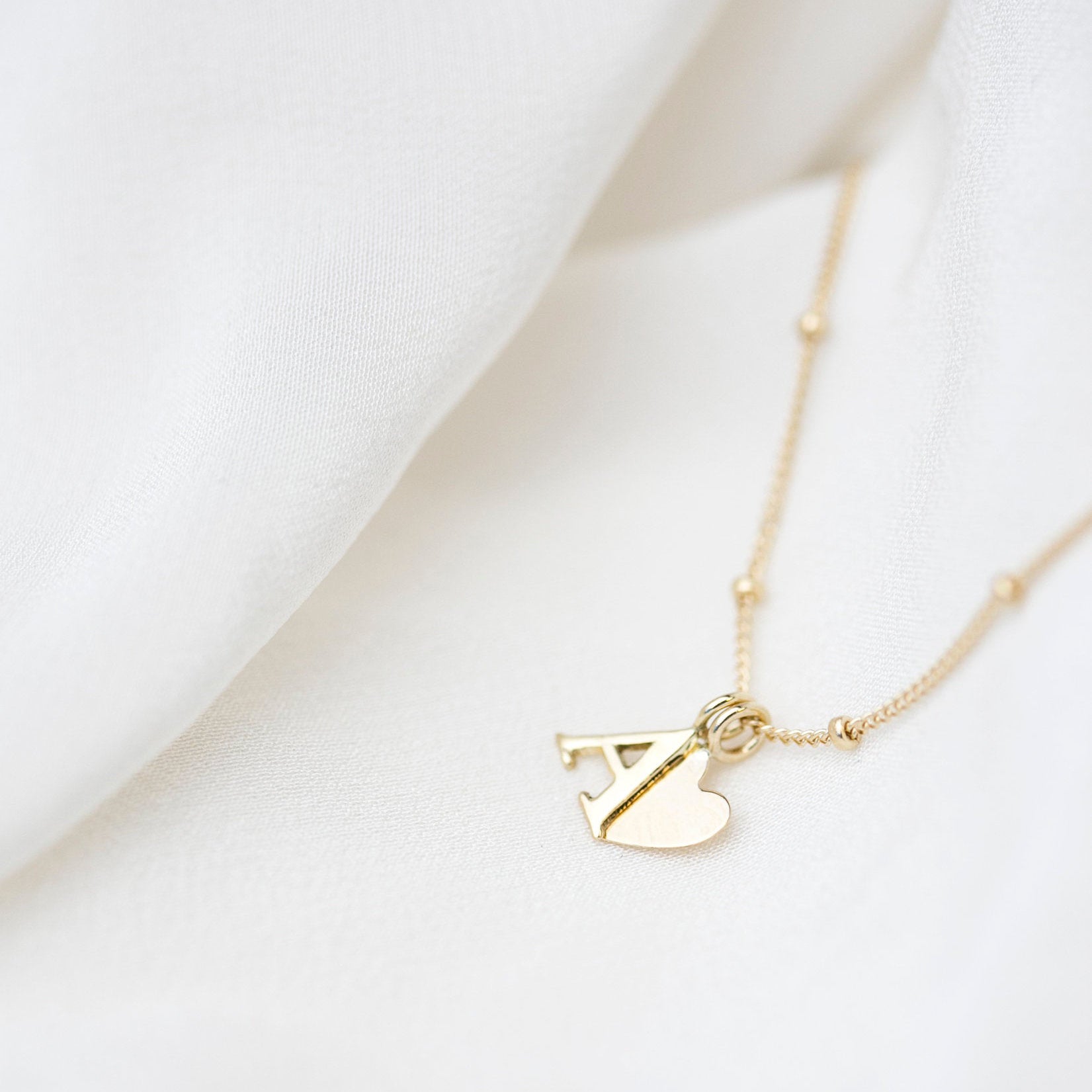 Personalized 14k solid gold initials necklace with beautiful beaded chain.Simple, minimalist everyday necklace.
Perfect wearing alone or layering with your favorite necklaces.