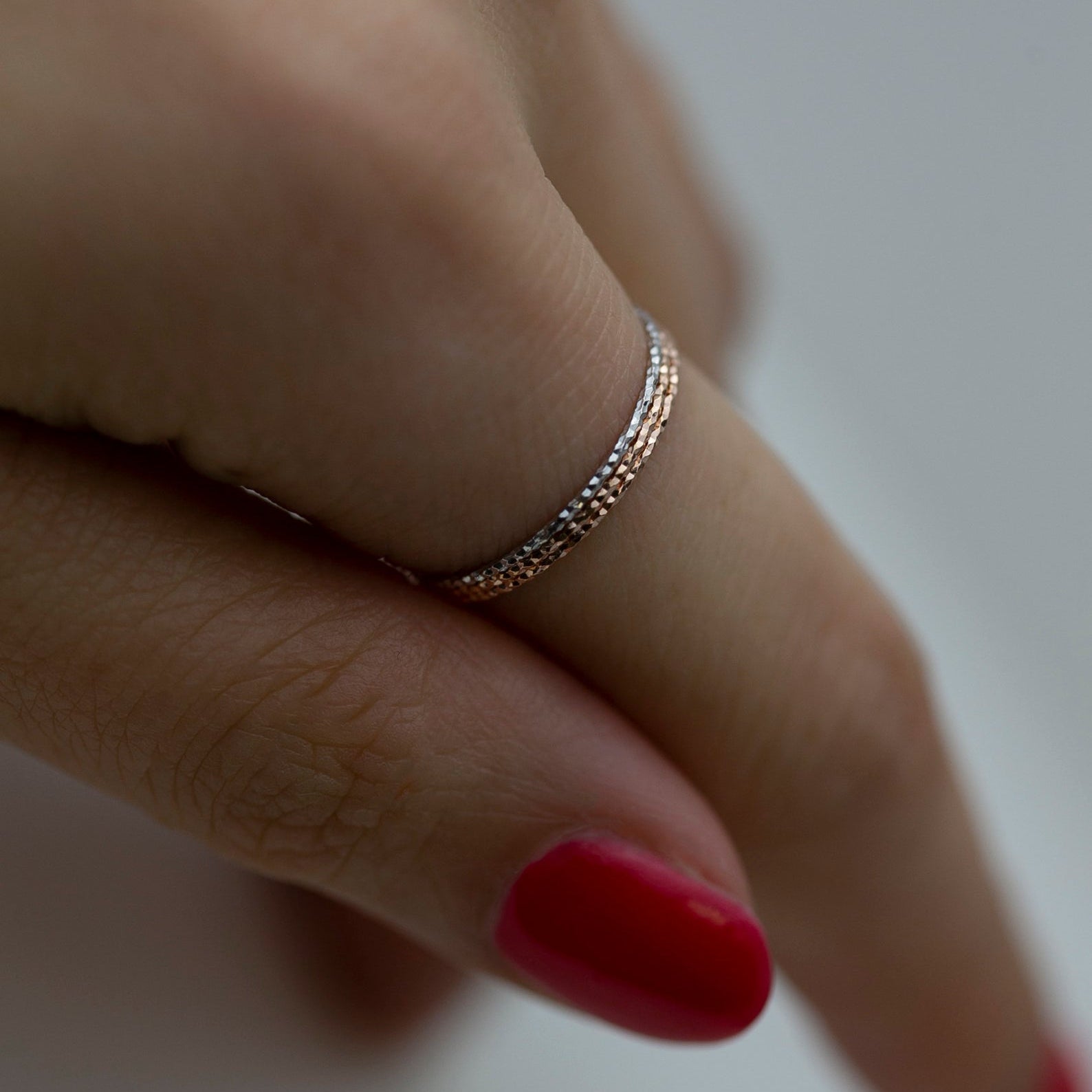 Crafted from 14k gold and featuring a diamond-cut design, these stacking rings offer a dainty and simplistic look that is perfect for everyday wear.