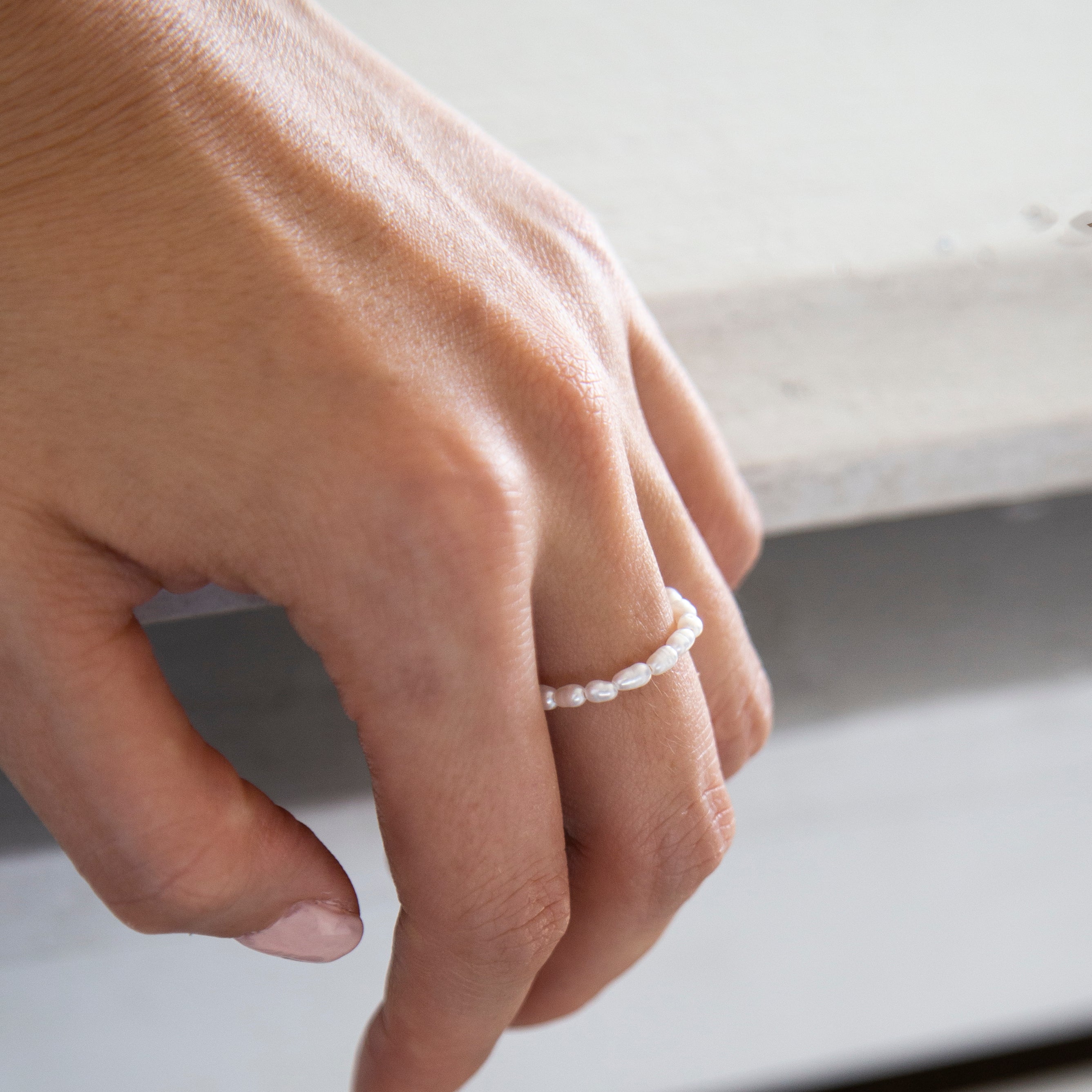 Baby Lotus Pearl Ring
Made with mini rice shape fresh water pearls and gold filled bead on a
comfy stretchy elastic band. Baby lotus pearl ring will be the perfect addition to your ring stack!