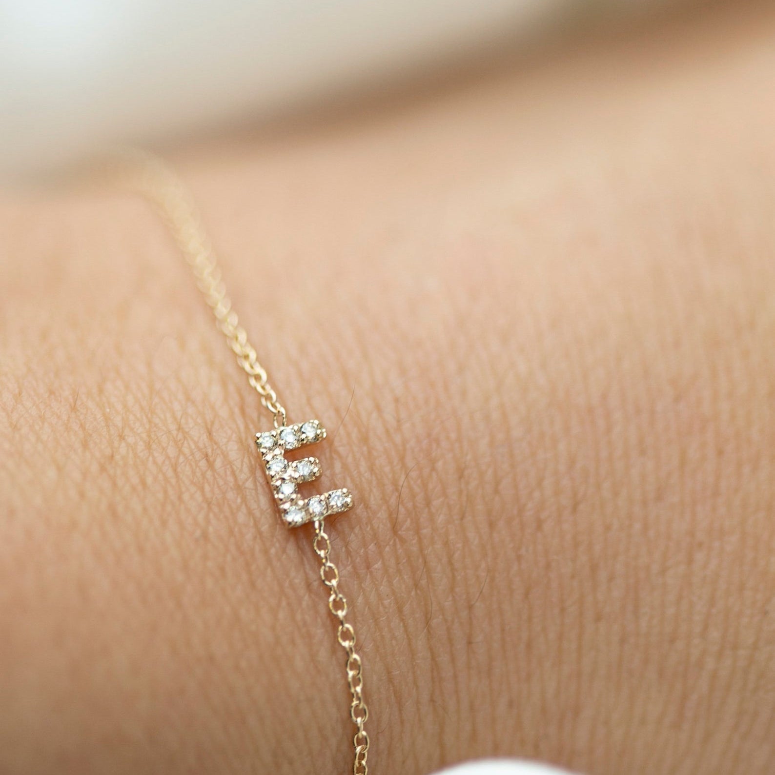 Personalized 14k solid gold mini diamond letter bracelet!
Indulge in understated luxury with our 14k Gold Mini Diamond Initial Bracelet, a delicate yet dazzling addition to your daily wardrobe. Adorned with a sparkling diamond and customizable with your choice of uppercase alphabet initial, this bracelet adds a touch of elegance and personalization to any outfit. The perfect choice for the woman who values simplicity and sophistication in her everyday style.
Great as a gift for special someone or for your