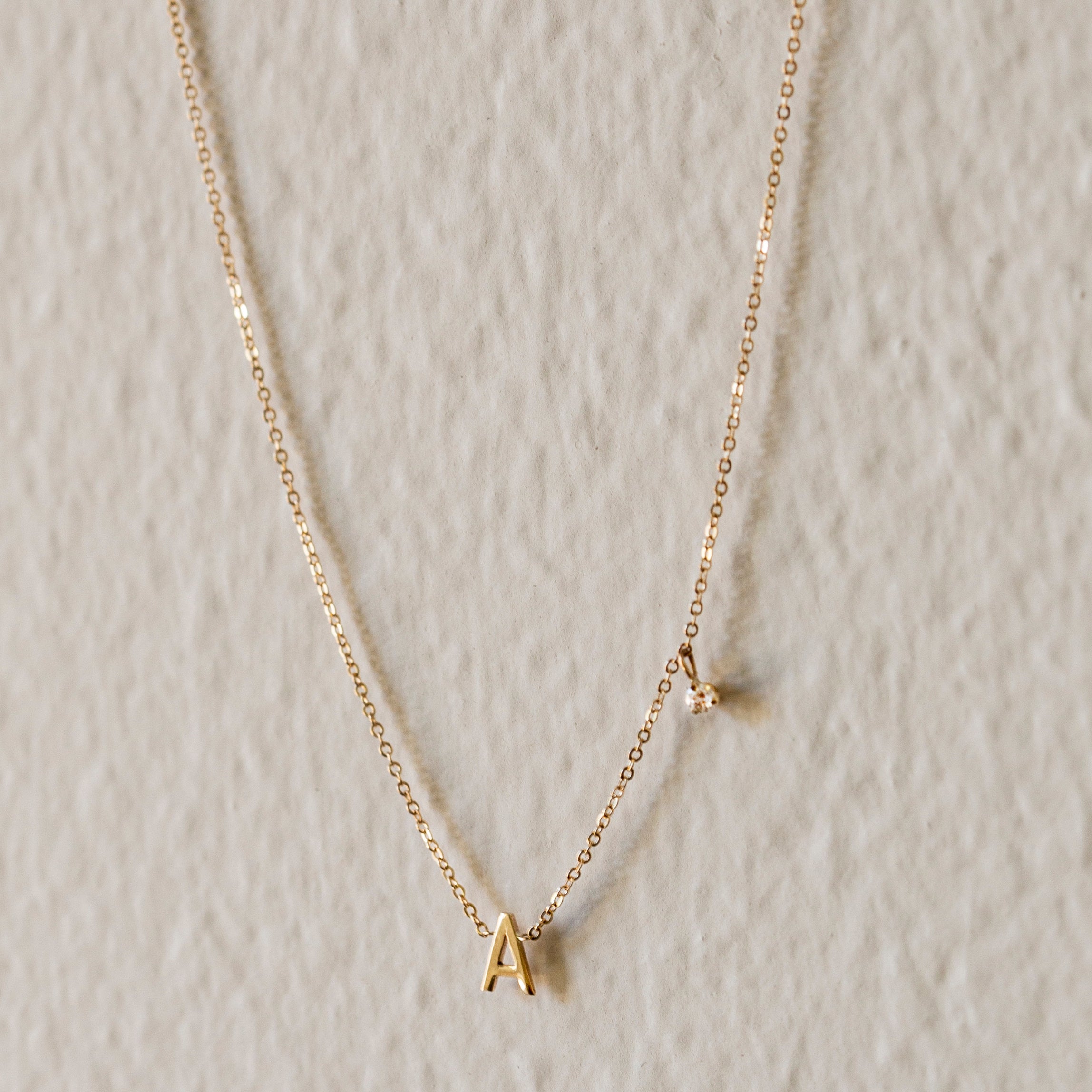 Personalized initial necklace with a diamond dangle