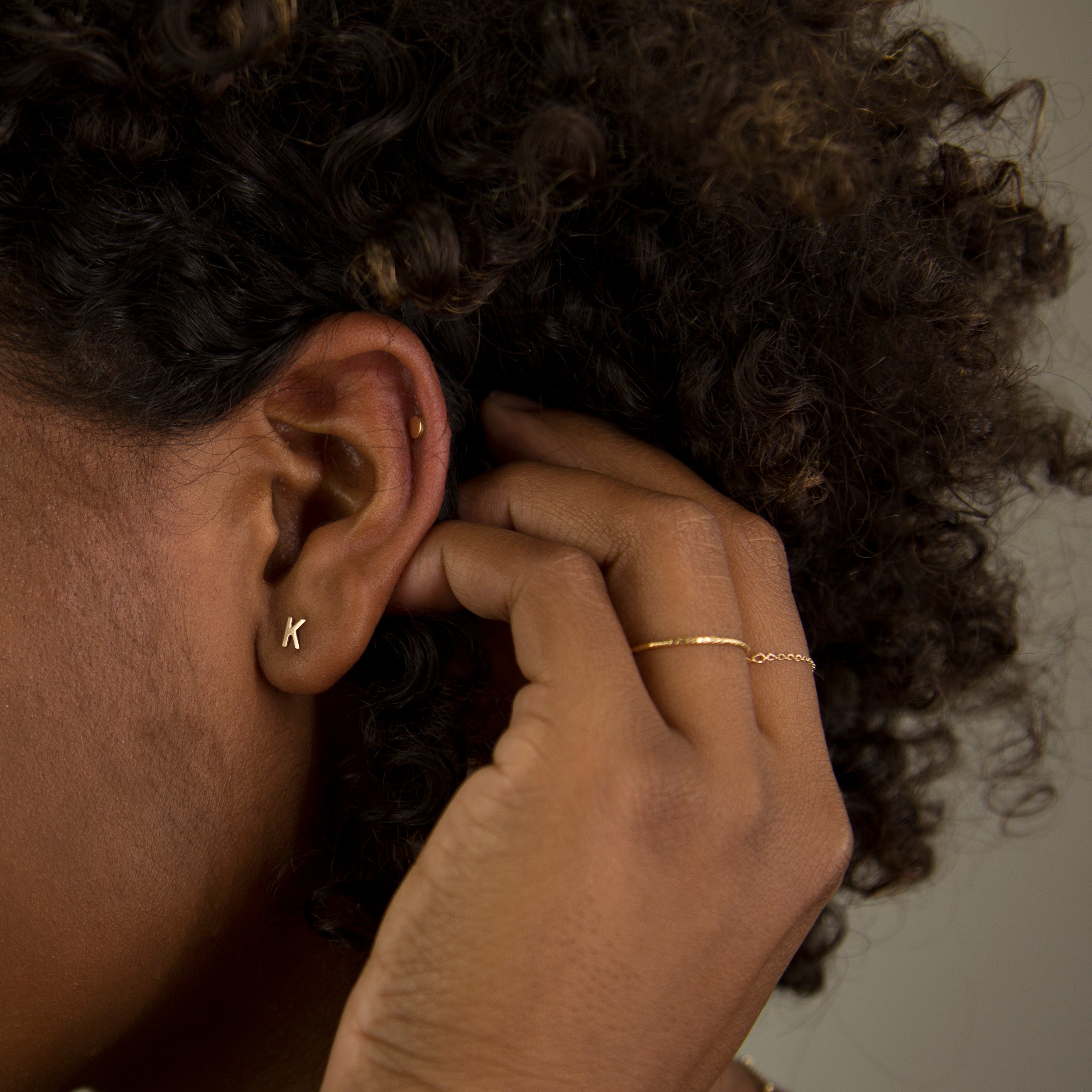 14K Initial stud Earrings - Enhance your style with a touch of sophistication and elegance using our 14K Solid Gold Initial Stud Earrings. Show off your initial and elevate your look with this exquisite accessory. Can be worn alone or paired with other earrings to create a stylish ear stack.