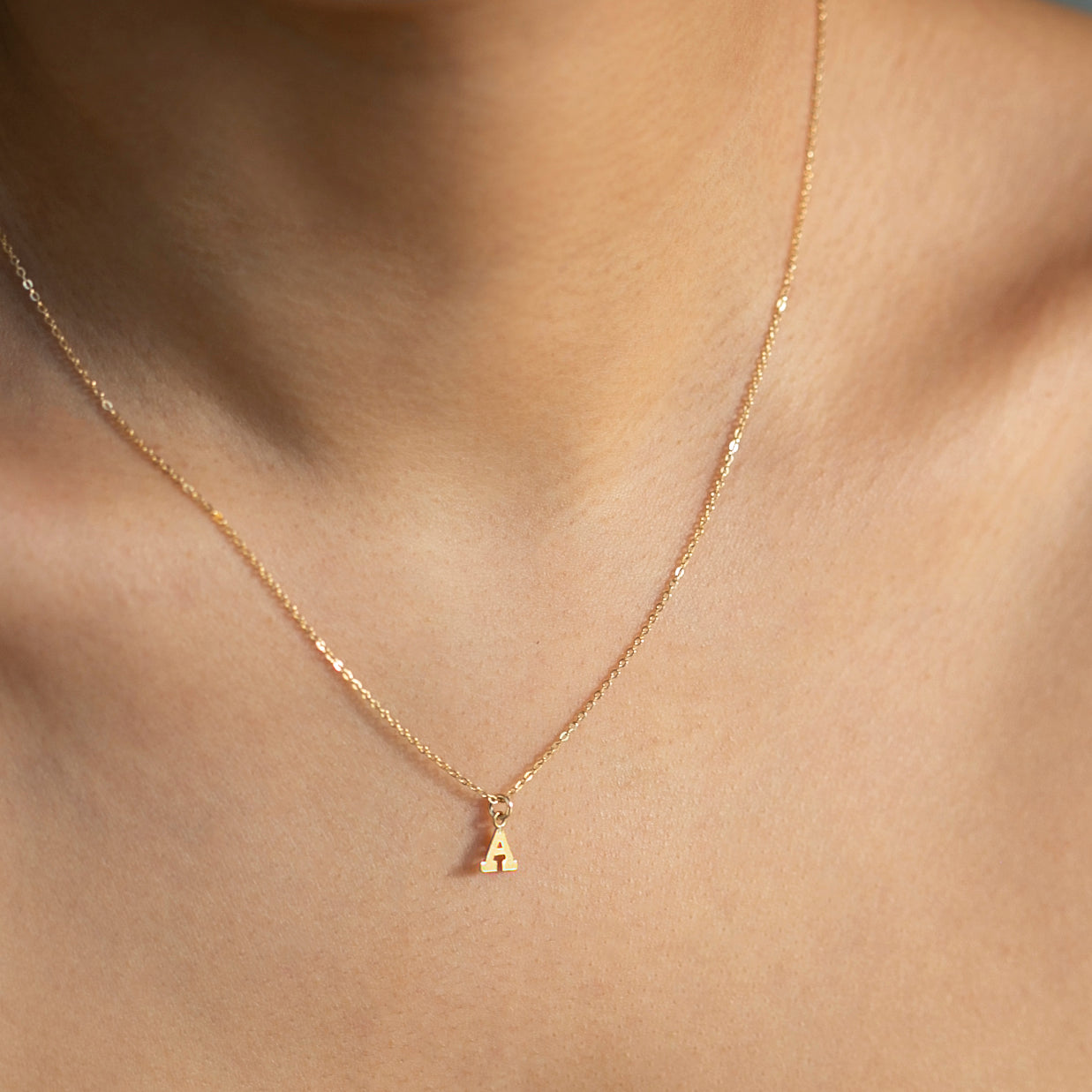 Mini initial necklace, perfect for adding a personal touch to any outfit.
Dainty Initial Necklace - Perfect wearing alone or layering with your favorite necklaces.