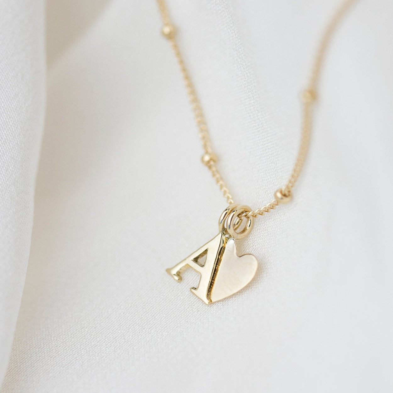 Personalized 14k solid gold initials necklace with beautiful beaded chain.Simple, minimalist everyday necklace.
Perfect wearing alone or layering with your favorite necklaces.