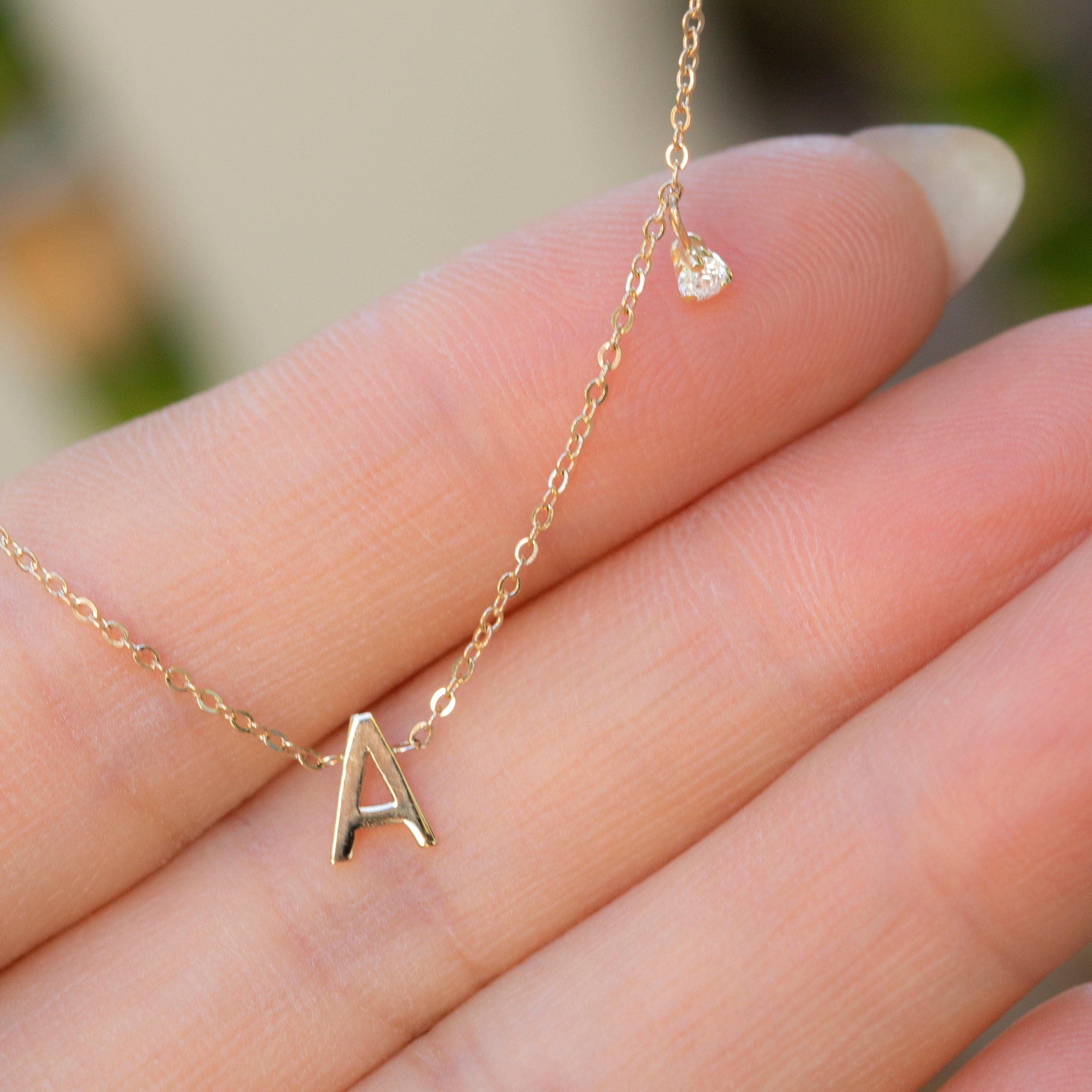 14k gold initial necklace, embellished with a delicate side diamond dangle.