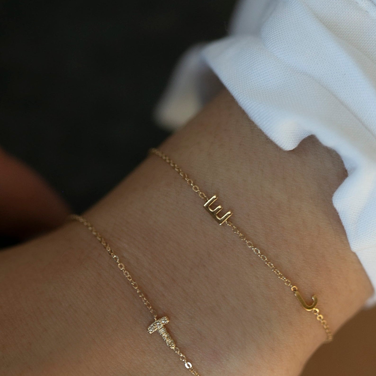 Personalized 14k solid gold mini diamond letter bracelet!
Indulge in understated luxury with our 14k Gold Mini Diamond Initial Bracelet, a delicate yet dazzling addition to your daily wardrobe. Adorned with a sparkling diamond and customizable with your choice of uppercase alphabet initial, this bracelet adds a touch of elegance and personalization to any outfit. The perfect choice for the woman who values simplicity and sophistication in her everyday style.
Great as a gift for special someone