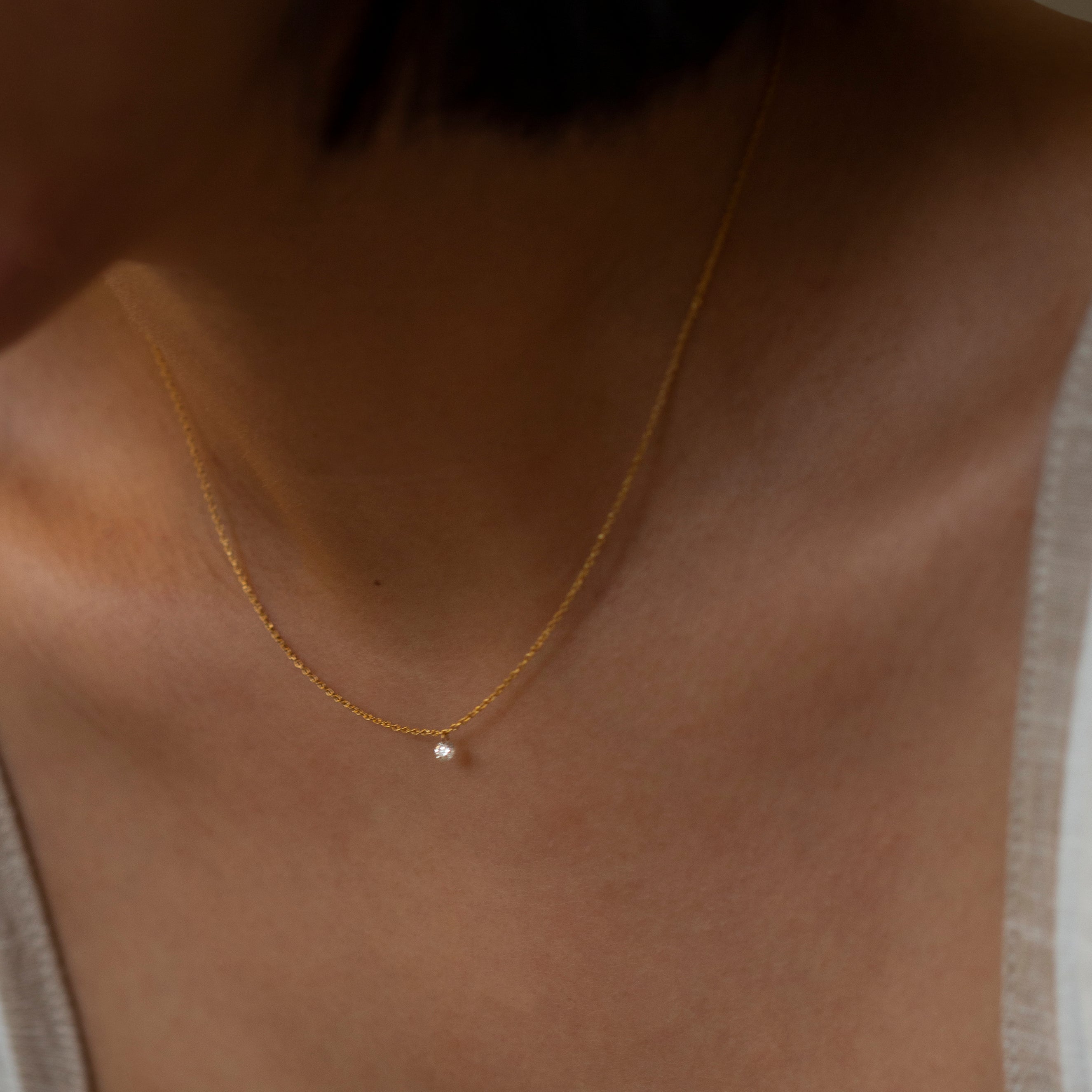 14k Gold chain with beautiful diamond in a drilled jump ring setting