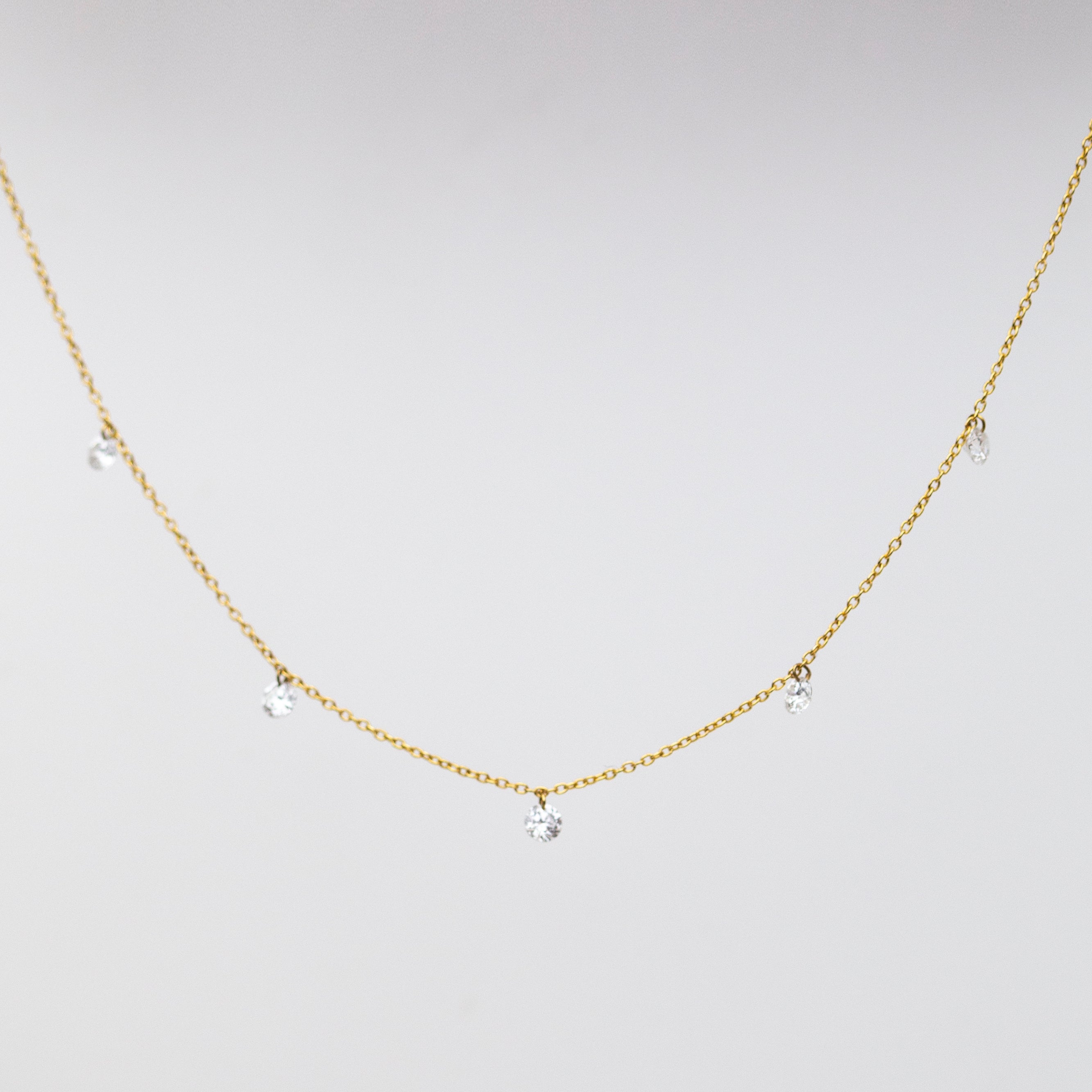 14k Gold chain with beautiful diamond in a drilled jump ring setting