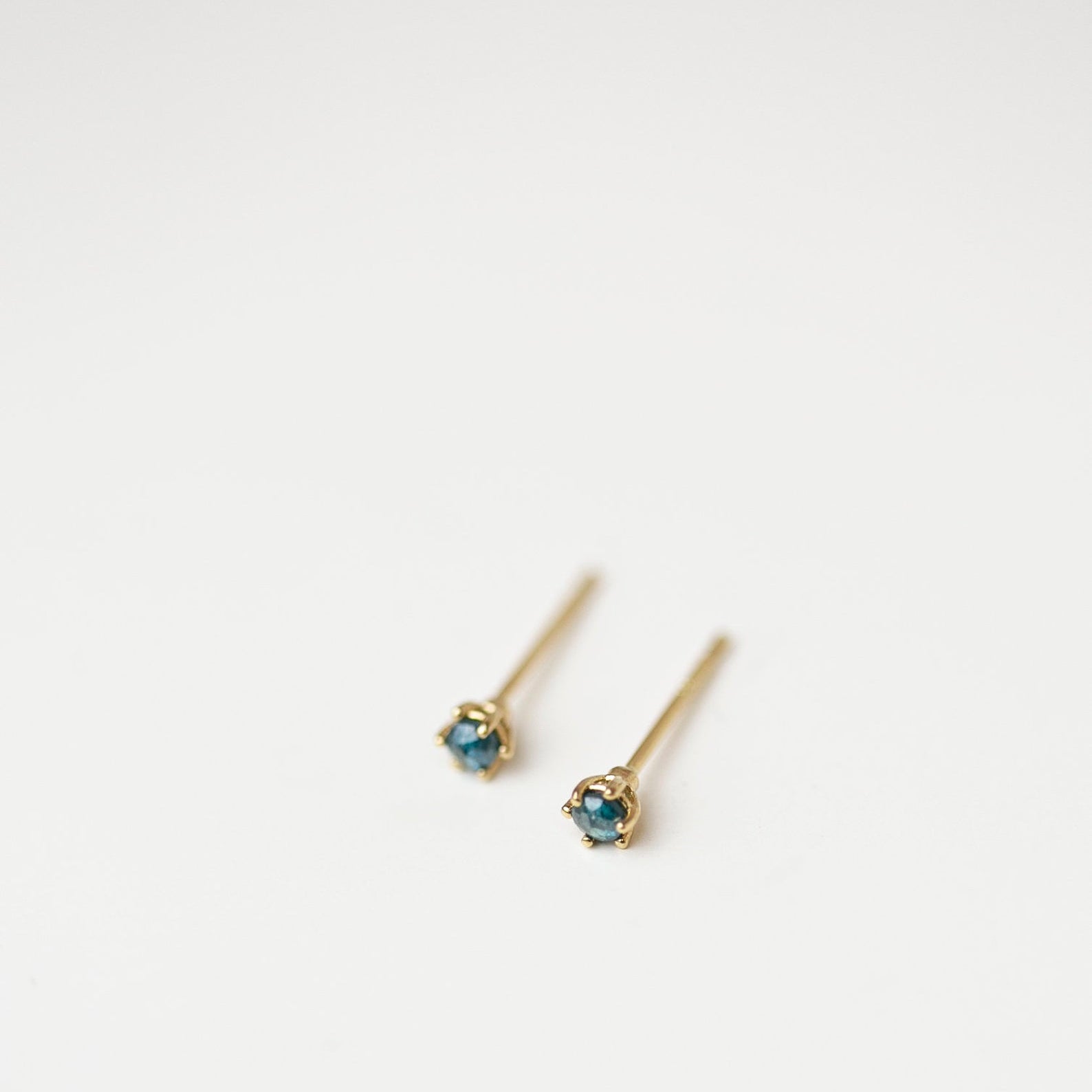 Gold Blue Rough Cut Diamond Solitaire Stud Earrings in 14k Gold.