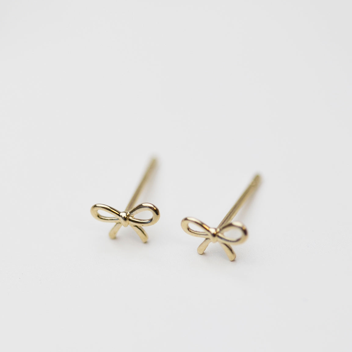 bow stud earrings