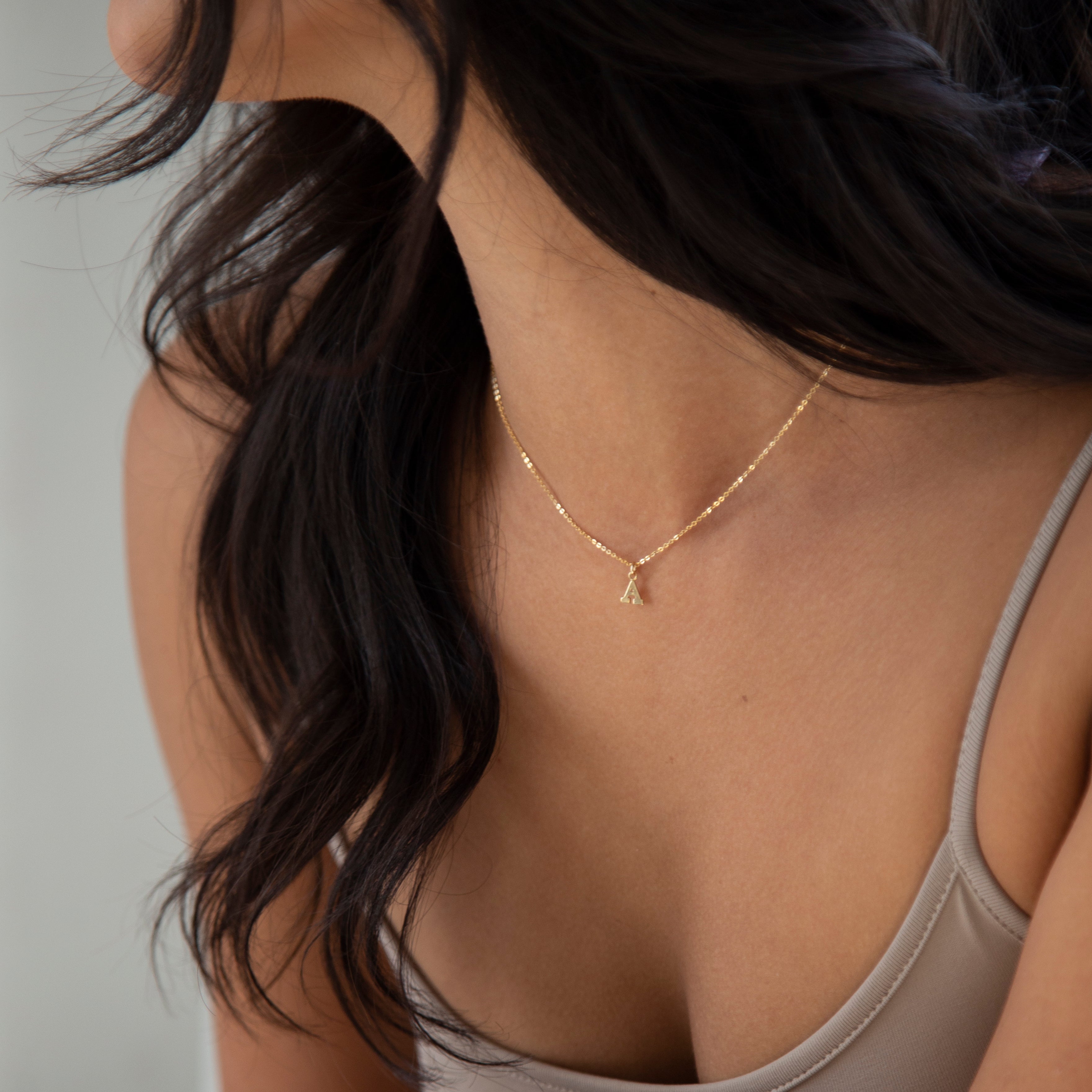 Mini initial necklace, perfect for adding a personal touch to any outfit.
Dainty Initial Necklace - Perfect wearing alone or layering with your favorite necklaces.
Super dainty & fun.