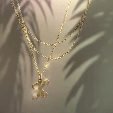 Cursive Letter Charm Necklace. Perfect wearing alone or layering with your favorite necklaces.