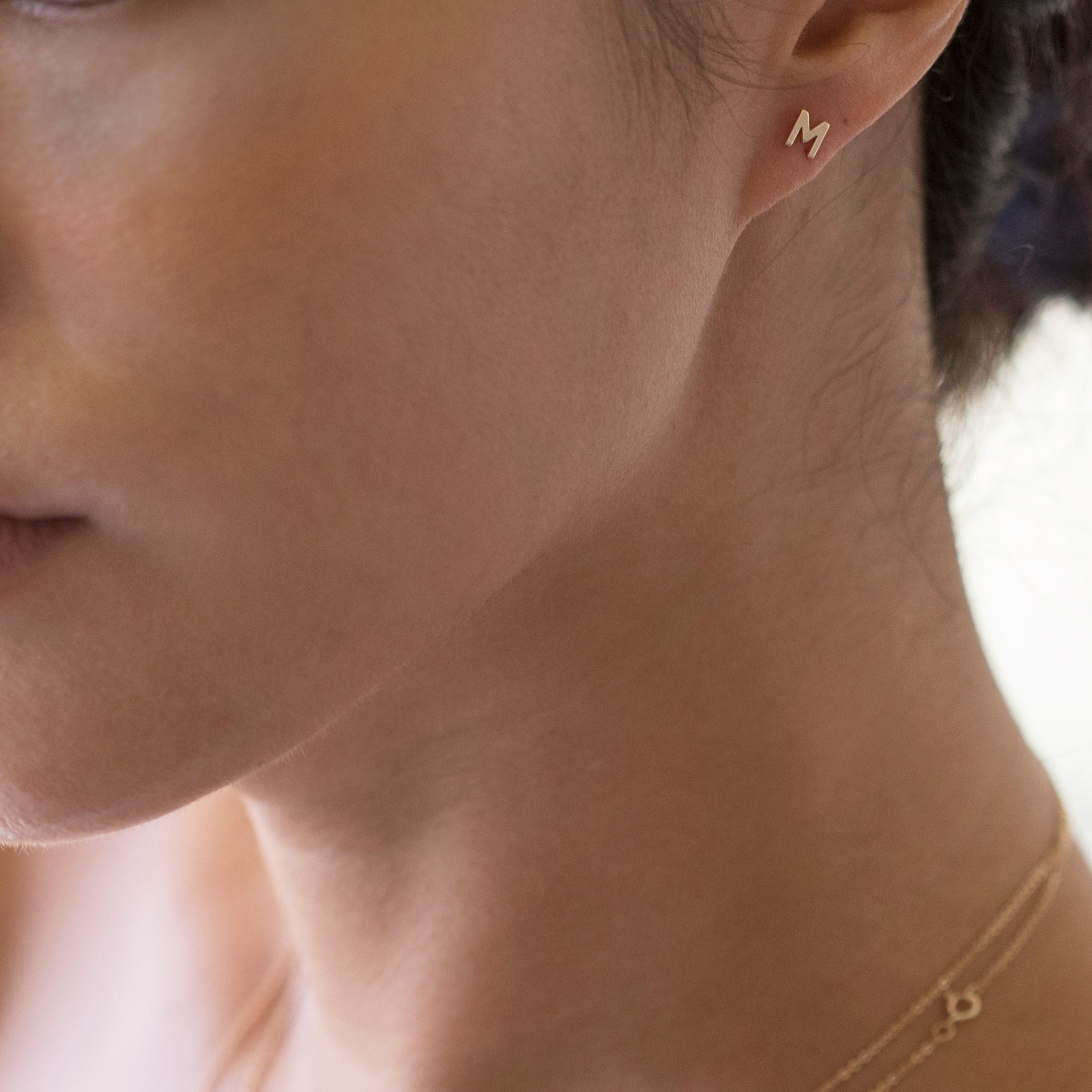 14K Initial stud Earrings - Enhance your style with a touch of sophistication and elegance using our 14K Solid Gold Initial Stud Earrings. Show off your initial and elevate your look with this exquisite accessory. Can be worn alone or paired with other earrings to create a stylish ear stack.