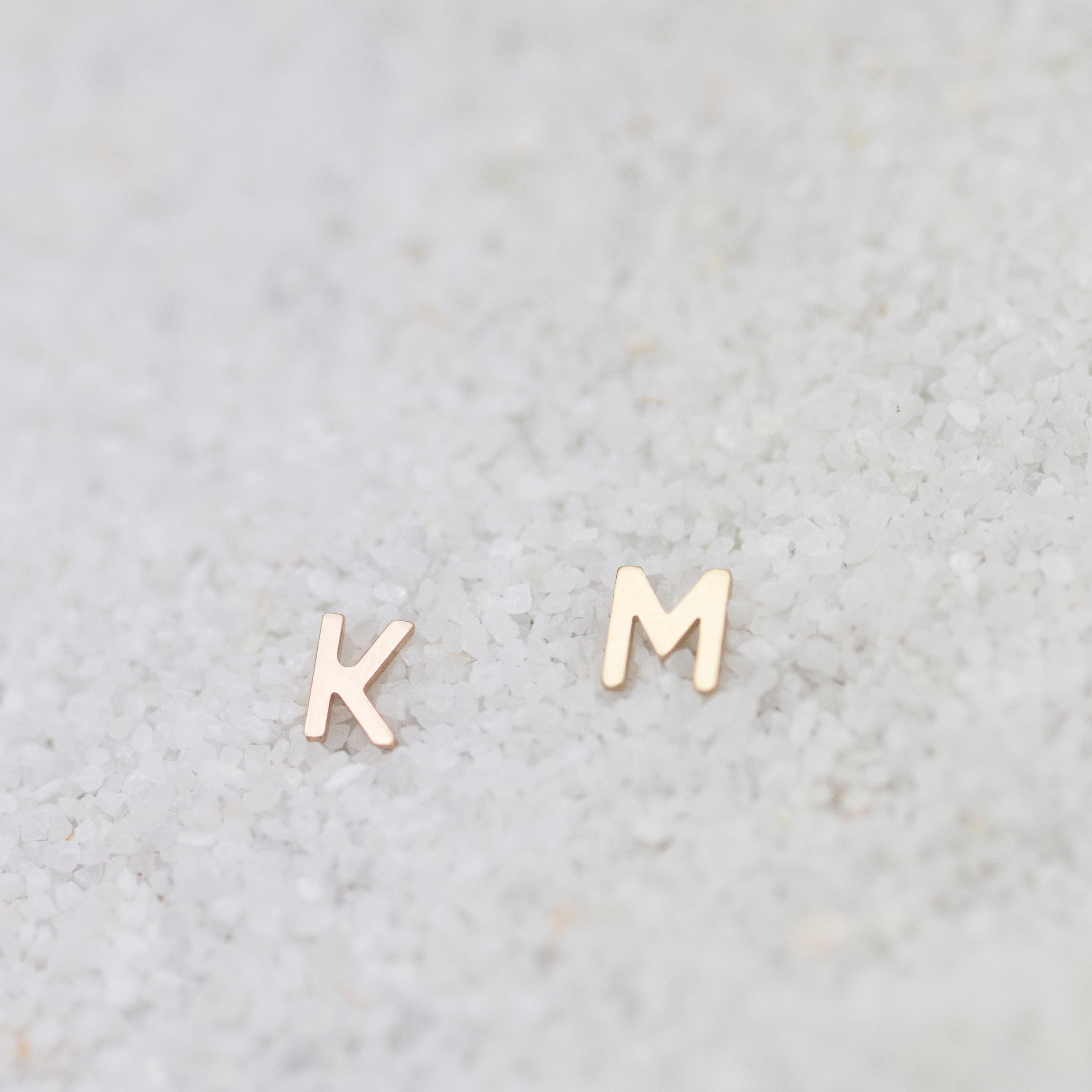 14K Initial stud Earrings - Enhance your style with a touch of sophistication and elegance using our 14K Solid Gold Initial Stud Earrings. Show off your initial and elevate your look with this exquisite accessory. Can be worn alone or paired with other earrings to create a stylish ear stack.