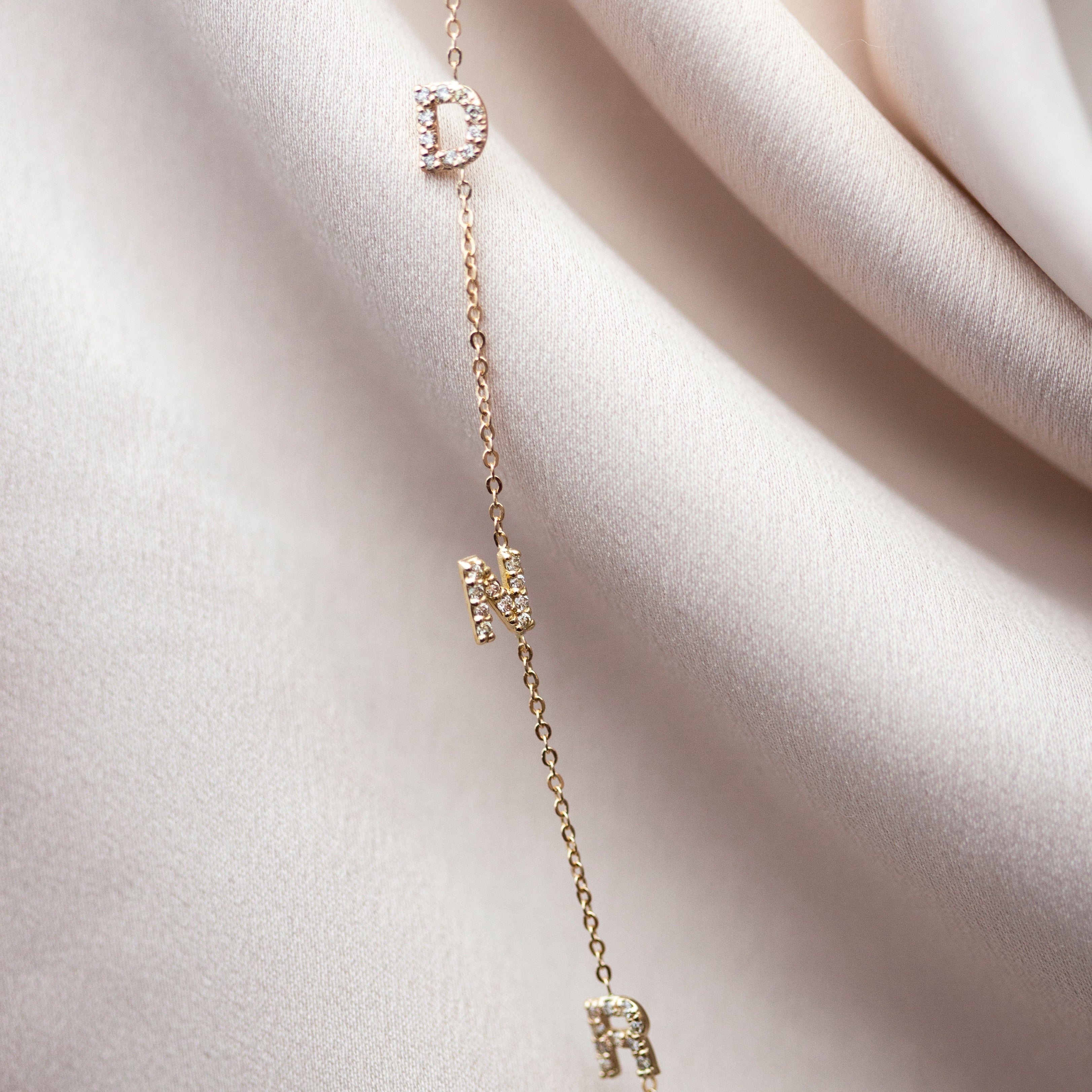 Personalized Asymmetrical 14k solid gold initials necklace.