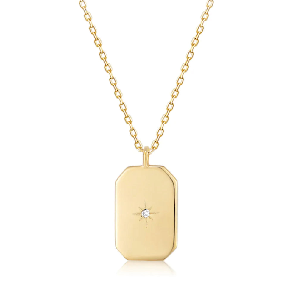 This 14k Gold Mini Diamond Tag Necklace is minimalistic and simple, yet adds a special touch with its small diamond star tag. It provides the perfect everyday accessory when worn alone or layered with other necklaces.