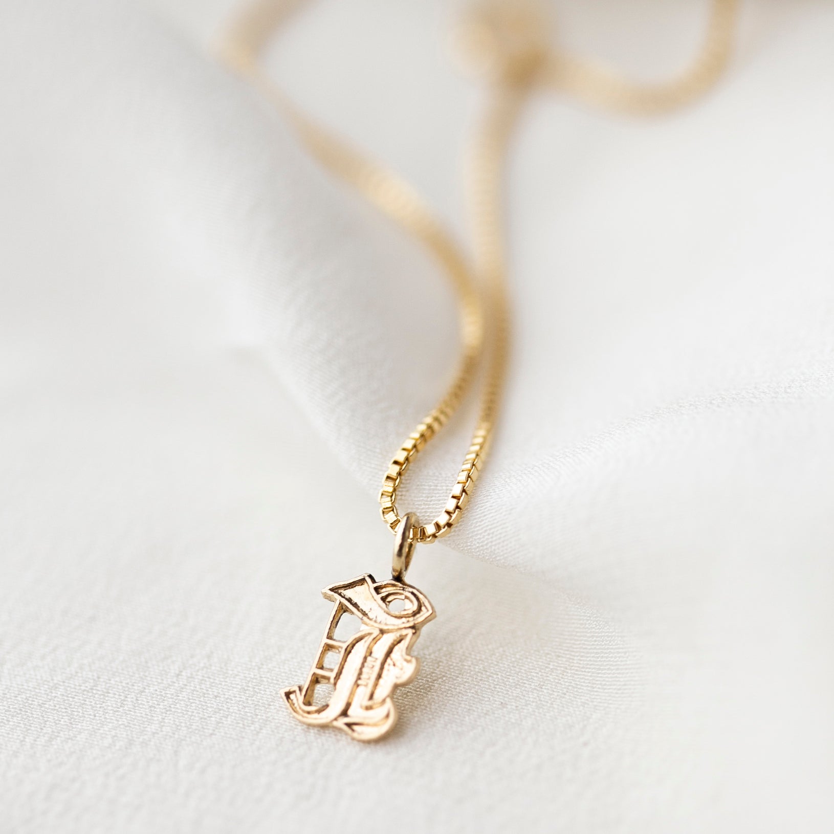 This Old english initial necklace is the perfect combination of edgy and elegant to make a unique statement.