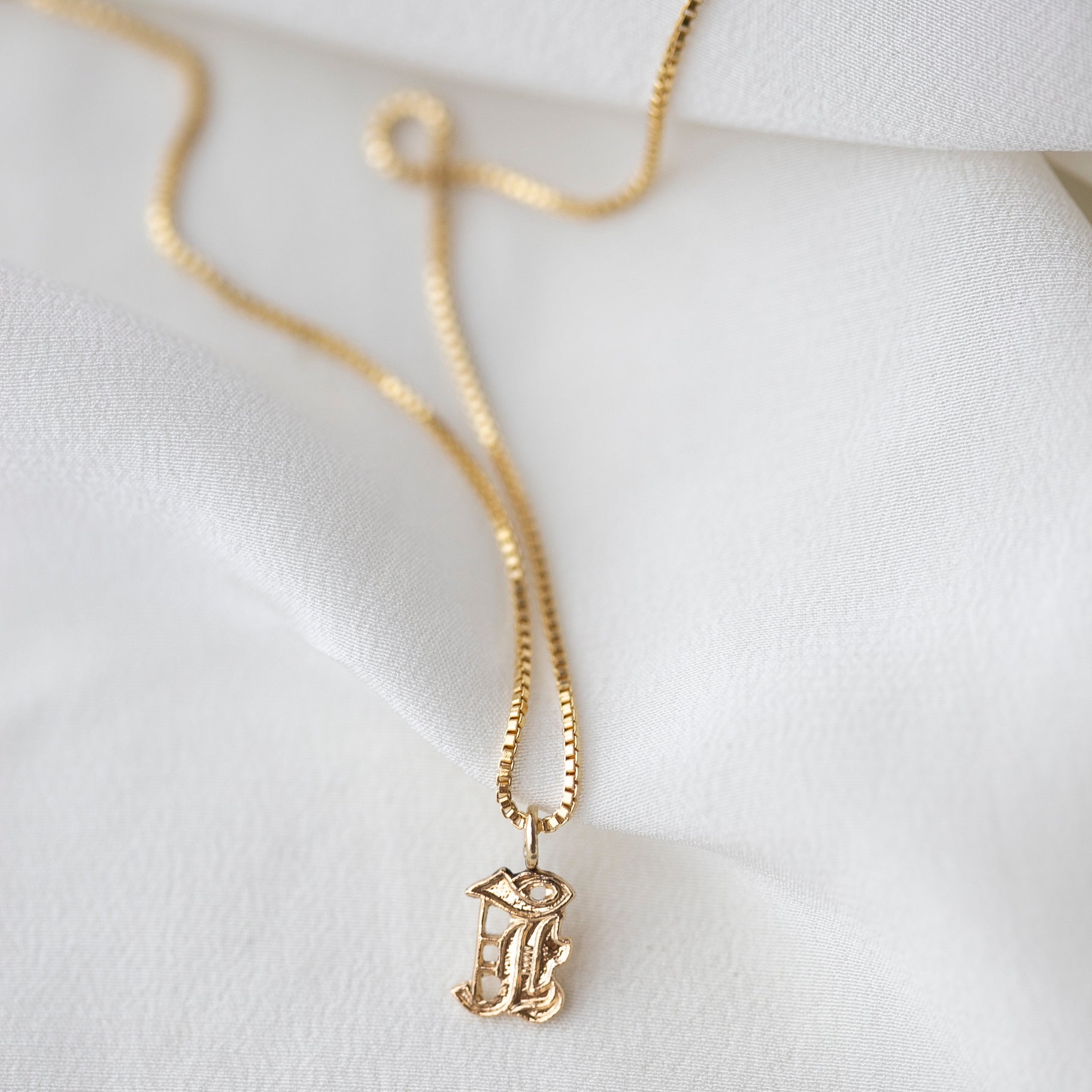 This Old english initial necklace is the perfect combination of edgy and elegant to make a unique statement.