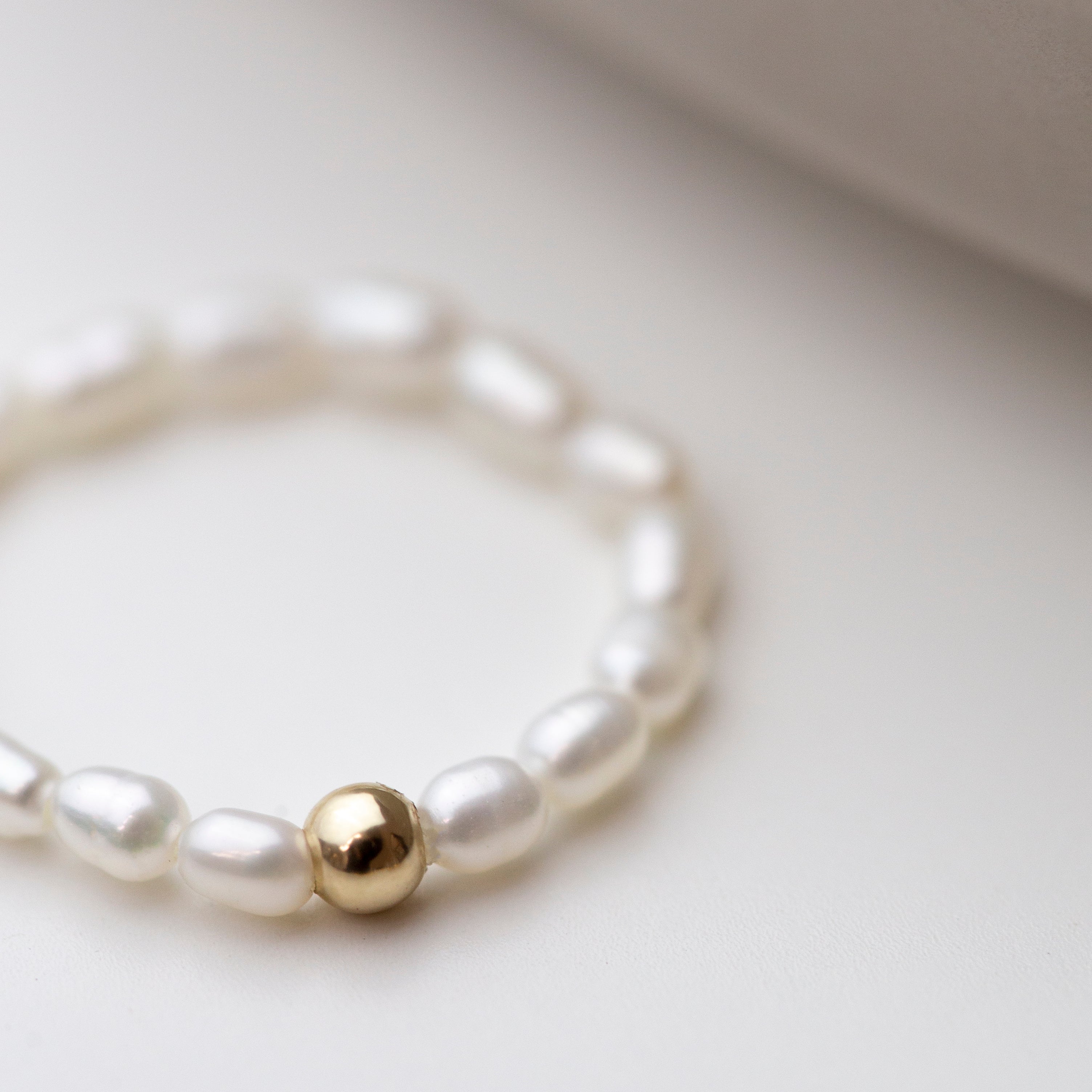 Baby Lotus Pearl Ring
Made with mini rice shape fresh water pearls and gold filled bead on a
comfy stretchy elastic band. Baby lotus pearl ring will be the perfect addition to your ring stack!