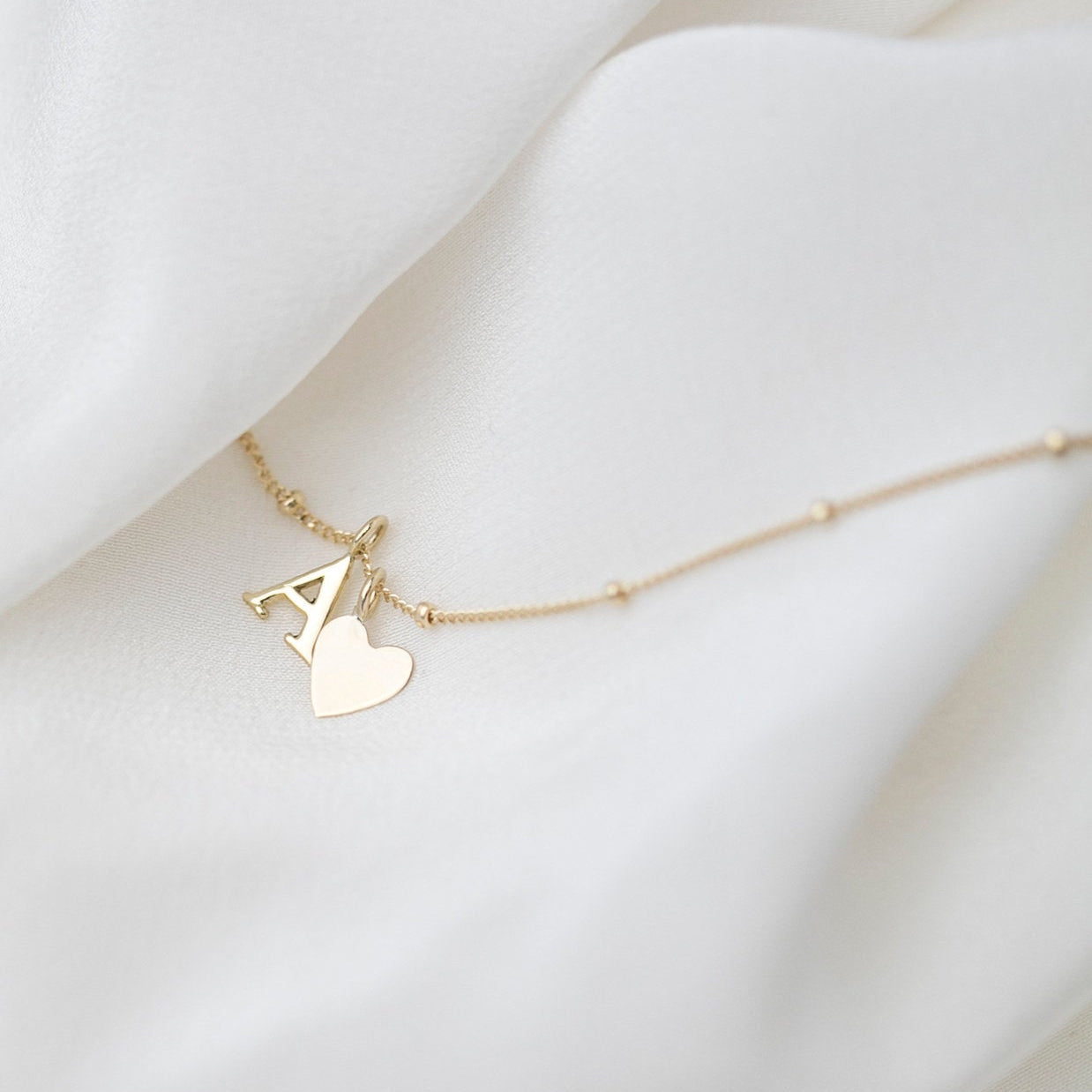 Personalized 14k solid gold initials necklace with beautiful beaded chain.Simple, minimalist everyday necklace.
Perfect wearing alone or layering with your favorite necklaces.