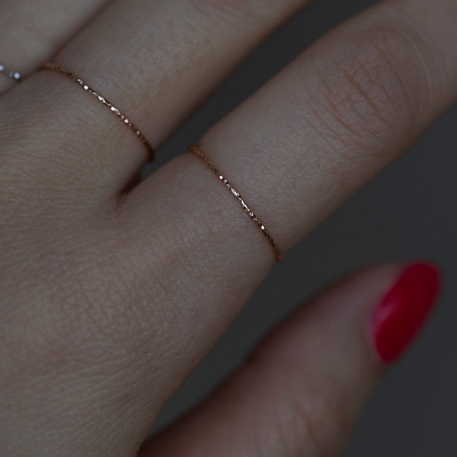 Crafted from 14k gold and featuring a diamond-cut design, these stacking rings offer a dainty and simplistic look that is perfect for everyday wear.