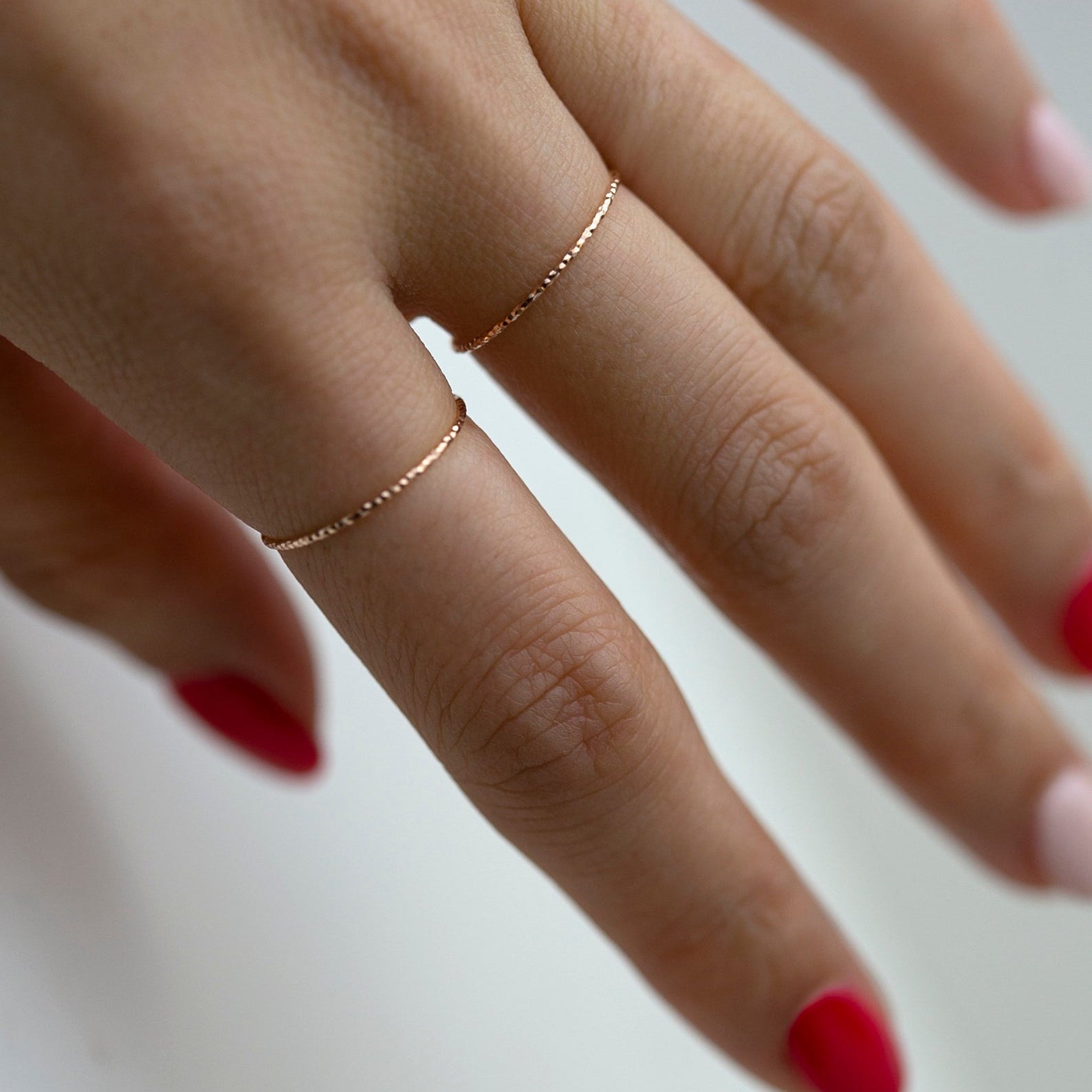 Crafted from 14k gold and featuring a diamond-cut design, these stacking rings offer a dainty and simplistic look that is perfect for everyday wear.