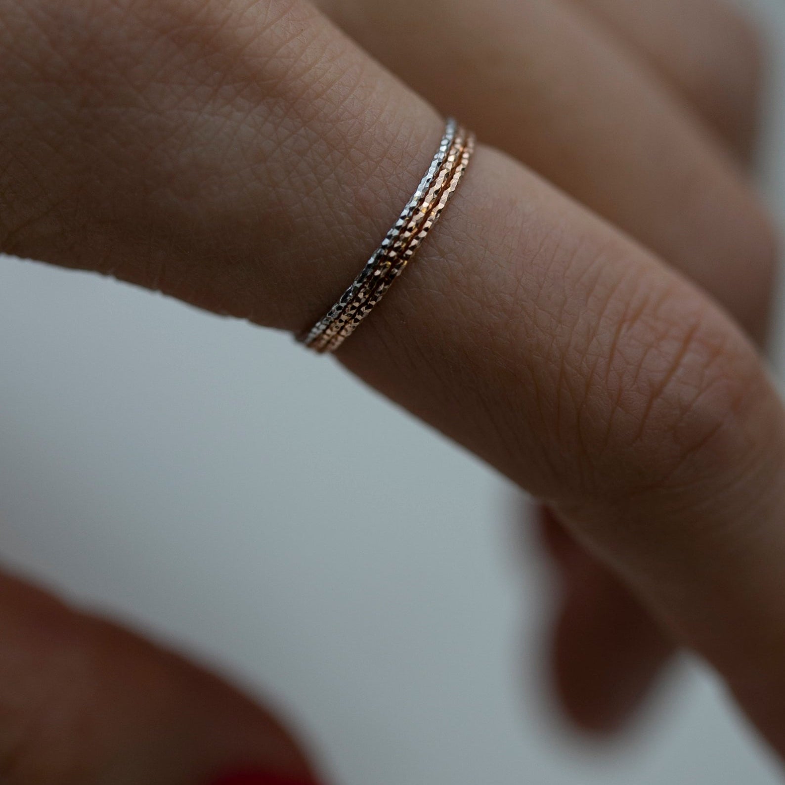 Crafted from 14k gold and featuring a diamond-cut design, these stacking rings offer a dainty and simplistic look that is perfect for everyday wear.