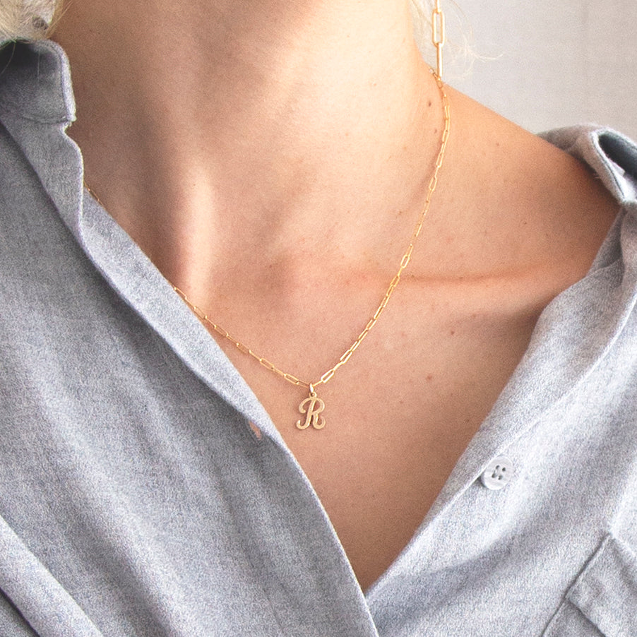 Cursive Letter Charm Necklace. Perfect wearing alone or layering with your favorite necklaces.
