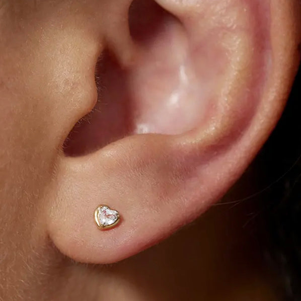 This 14k Heart White Topaz Stud Earring offers unique minimalism and superior craftsmanship for a timeless look. It has a screw flat back for extra security and comfort.
Minimalist, high quality, and timeless.
Very secure and comfortable to wear.