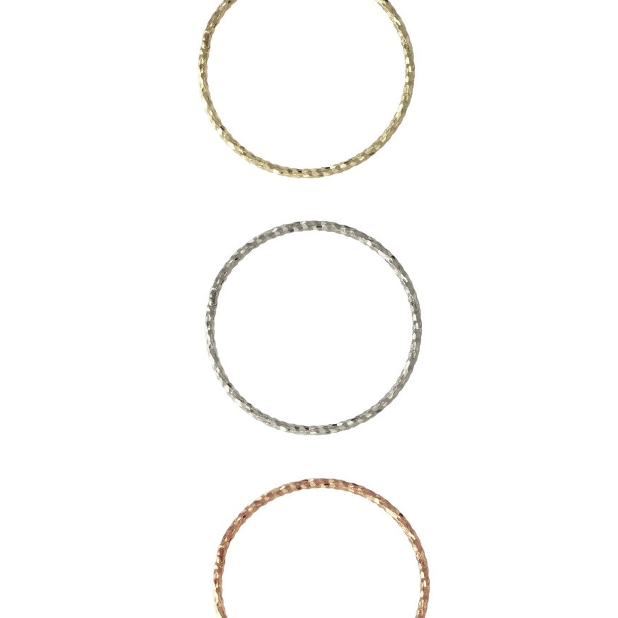 Crafted from 14k gold and featuring a diamond-cut design, these stacking rings offer a dainty and simplistic look that is perfect for everyday wear.