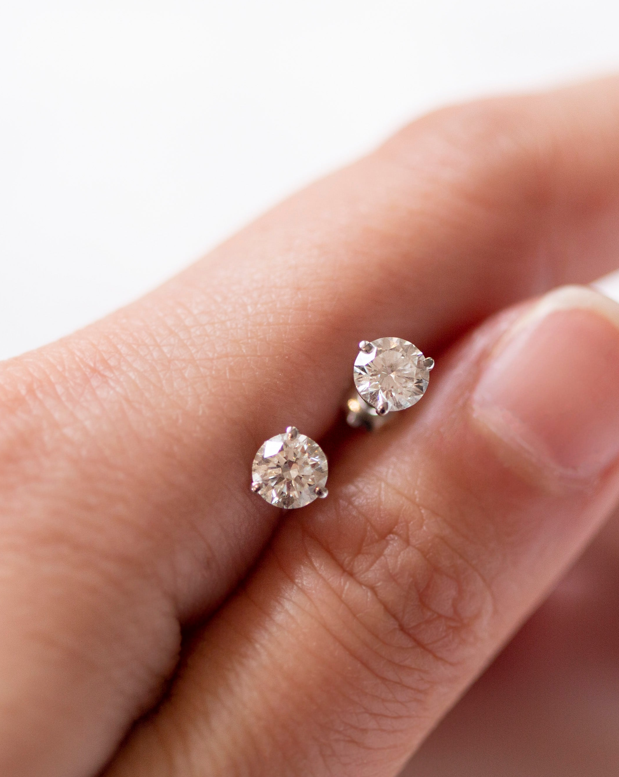 Enhance your elegance with these exquisite 14Kt gold lab diamond earrings, featuring a mesmerizing 1 Ct. TW. Martini set for a touch of sophistication. A must-have staple for every occasion.