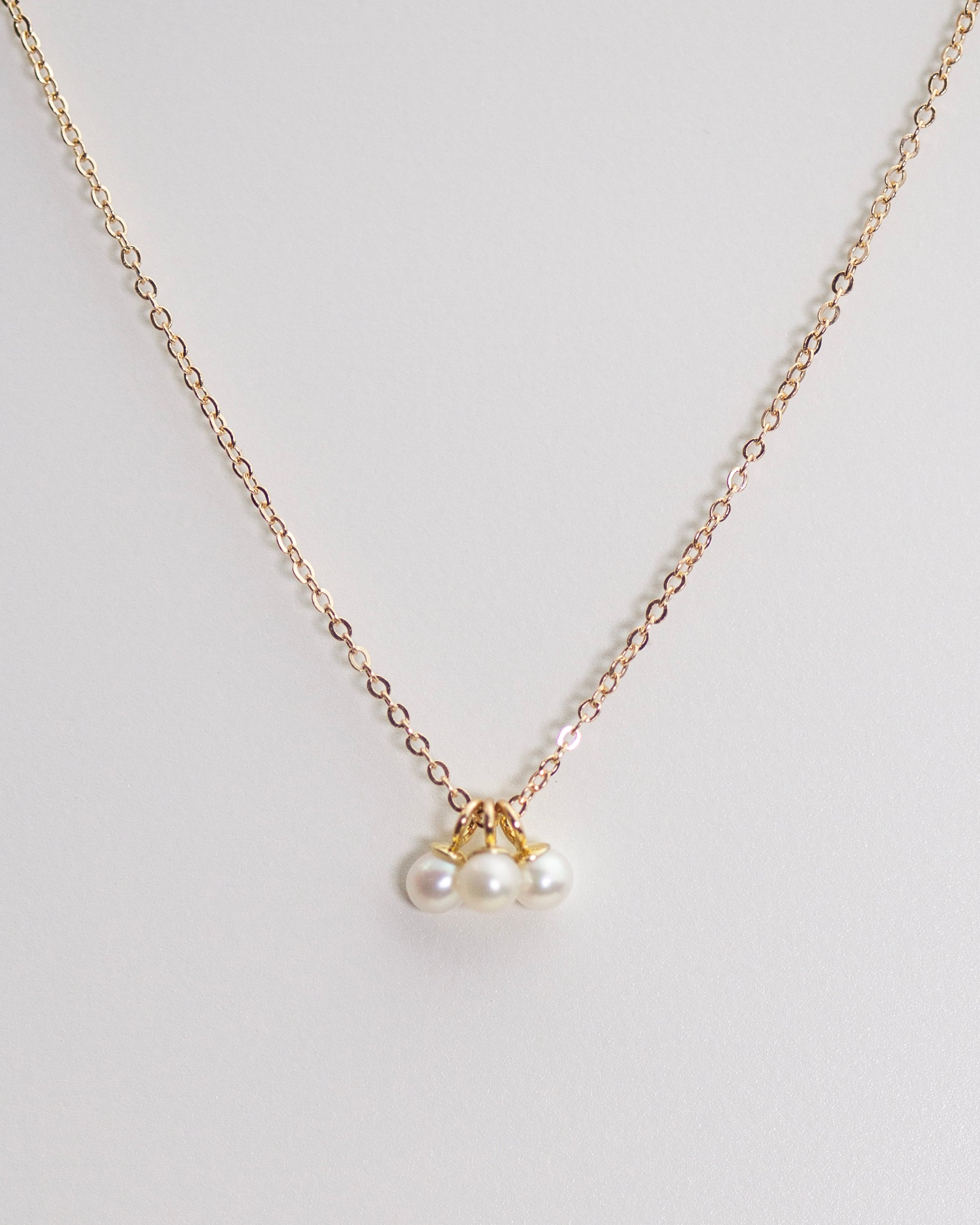 This Mini Pearl Pendant Necklace is the perfect complement for your evening wear or casual wardrobe. Crafted from 14k gold, this delicate necklace features a small cultured pearl, lending it a minimalist and elegant look. With this classic and versatile accessory, you're sure to make a statement.