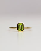 The octagon-shaped peridot on this ring is both eye-catching and elegantly simplistic. It is the perfect way to celebrate a special August birthday or simply adorn oneself with its stunning light green hue.