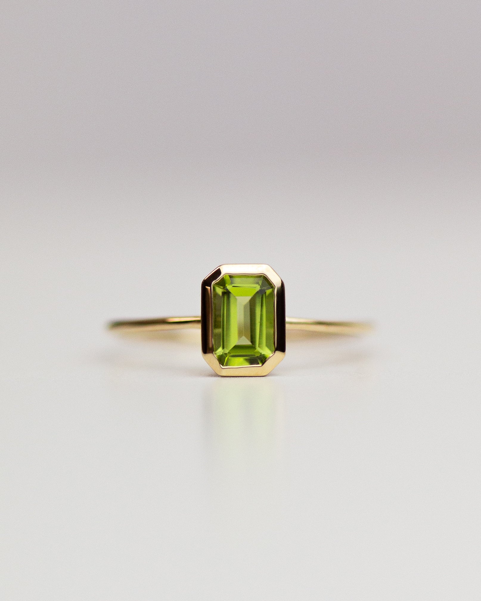 The octagon-shaped peridot on this ring is both eye-catching and elegantly simplistic. It is the perfect way to celebrate a special August birthday or simply adorn oneself with its stunning light green hue.