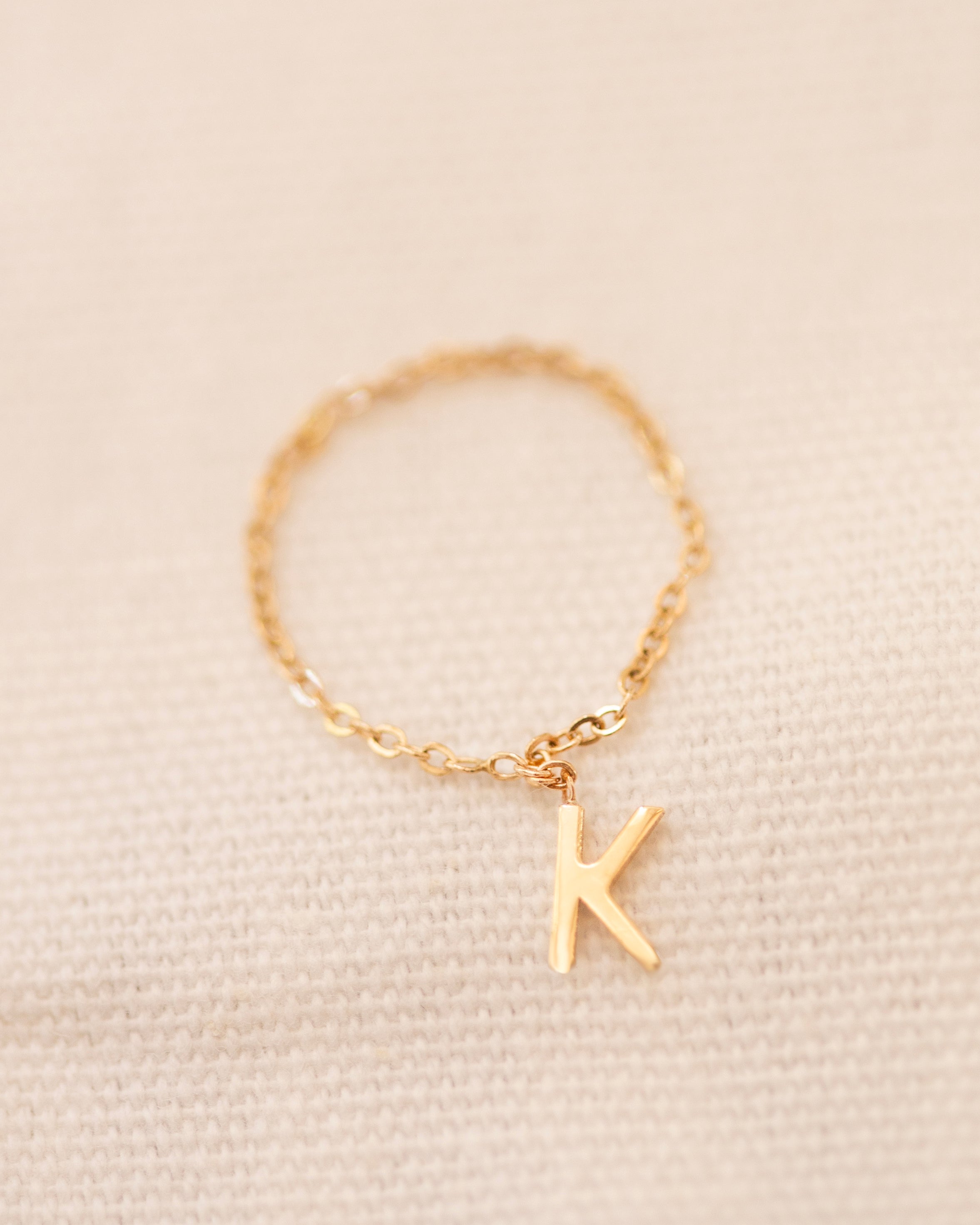 Barely there ring in 14k gold with small initial letter